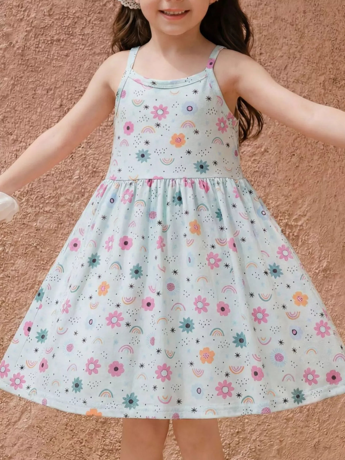 Pale blue floral-and-rainbow spaghetti-strap dress on a child
