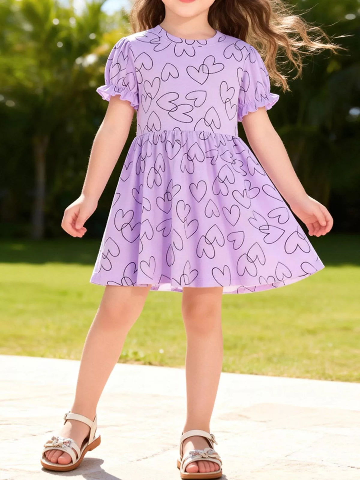 Lavender outlined-heart dress with puff sleeves on a child