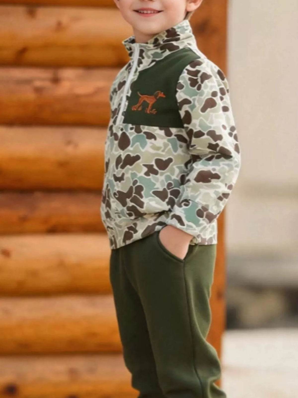 Green camouflage top and green joggers on a child