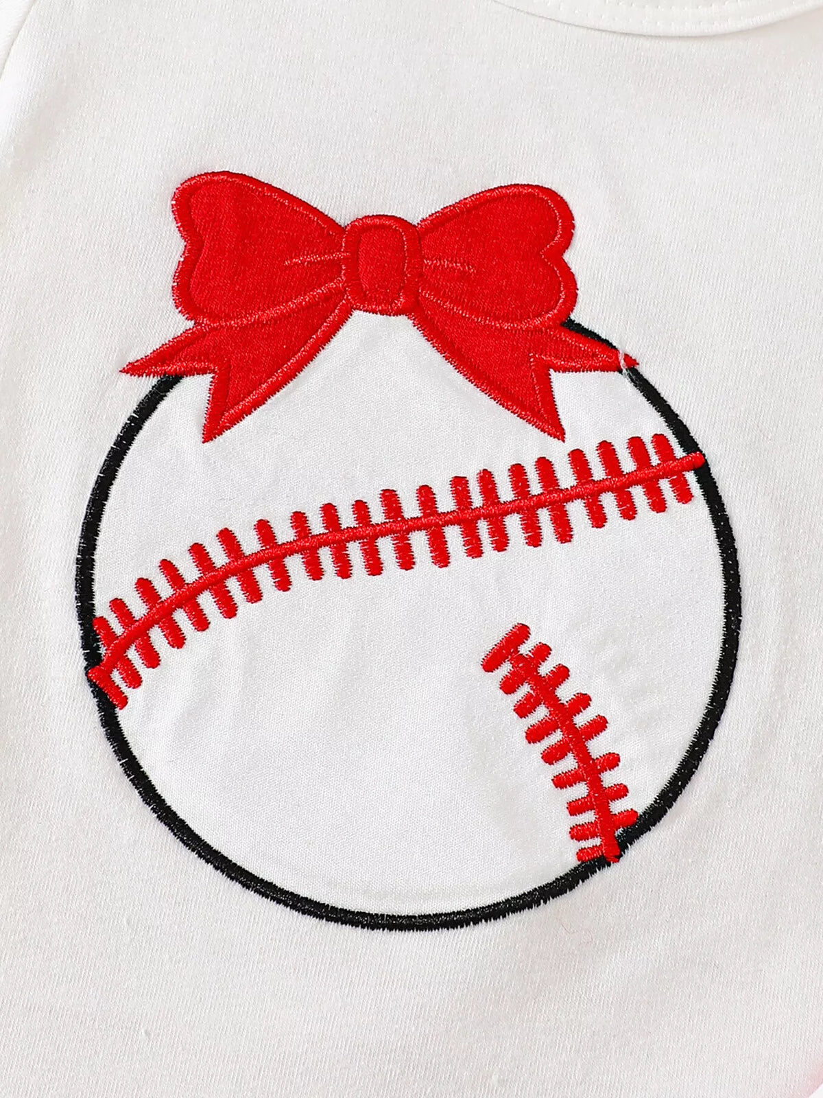 Baseball graphic topped with a red bow