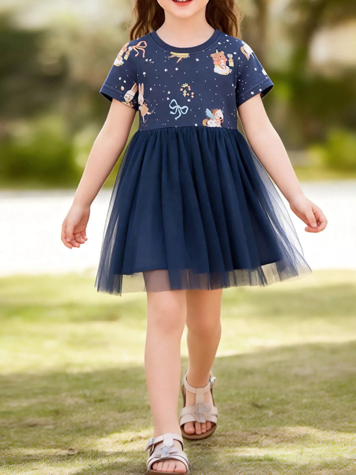 Navy cartoon-bear dress with a tulle skirt on a child
