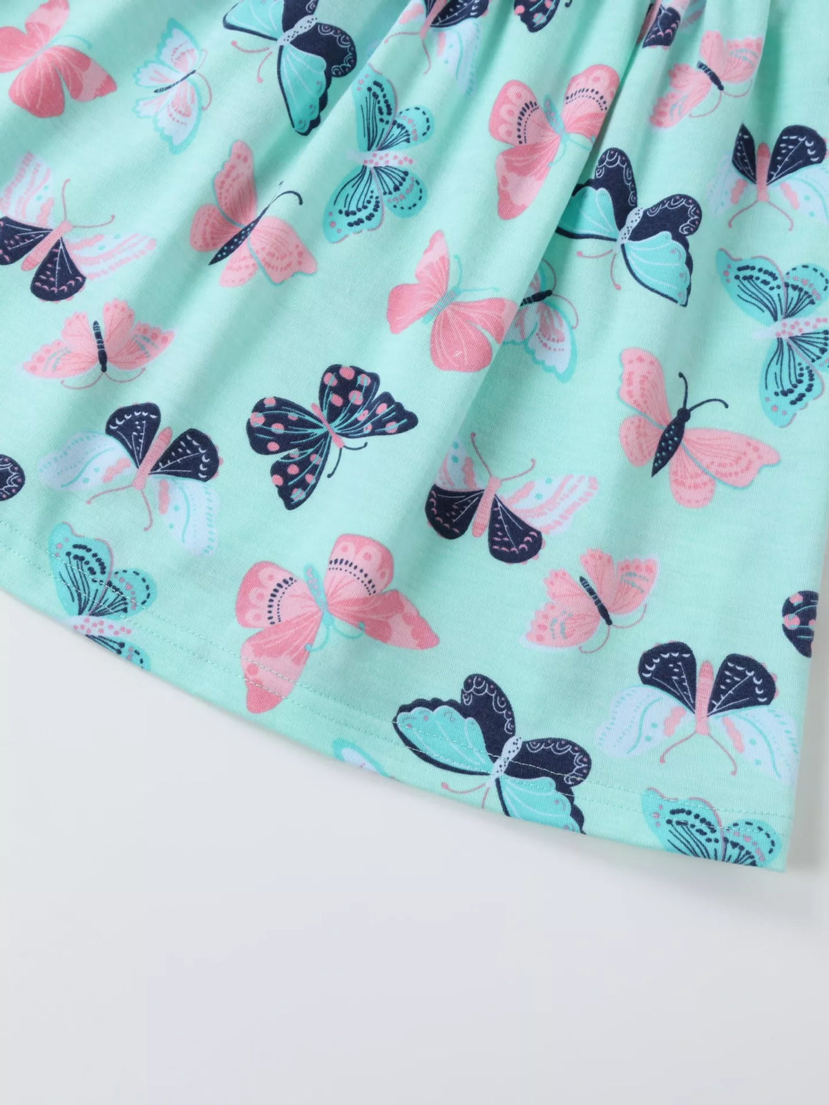 Pink and navy butterflies on the aqua skirt