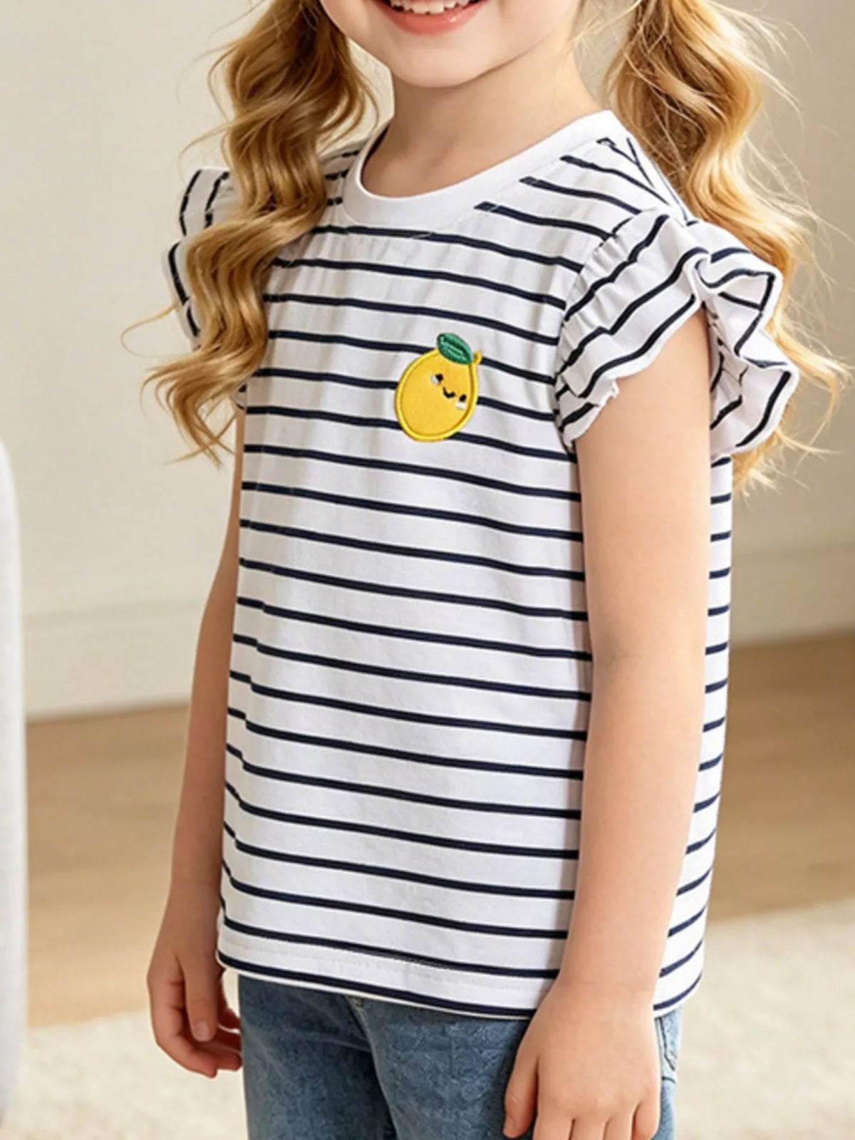 White navy striped lemon applique ruffle sleeve shirt — shirt shown on child