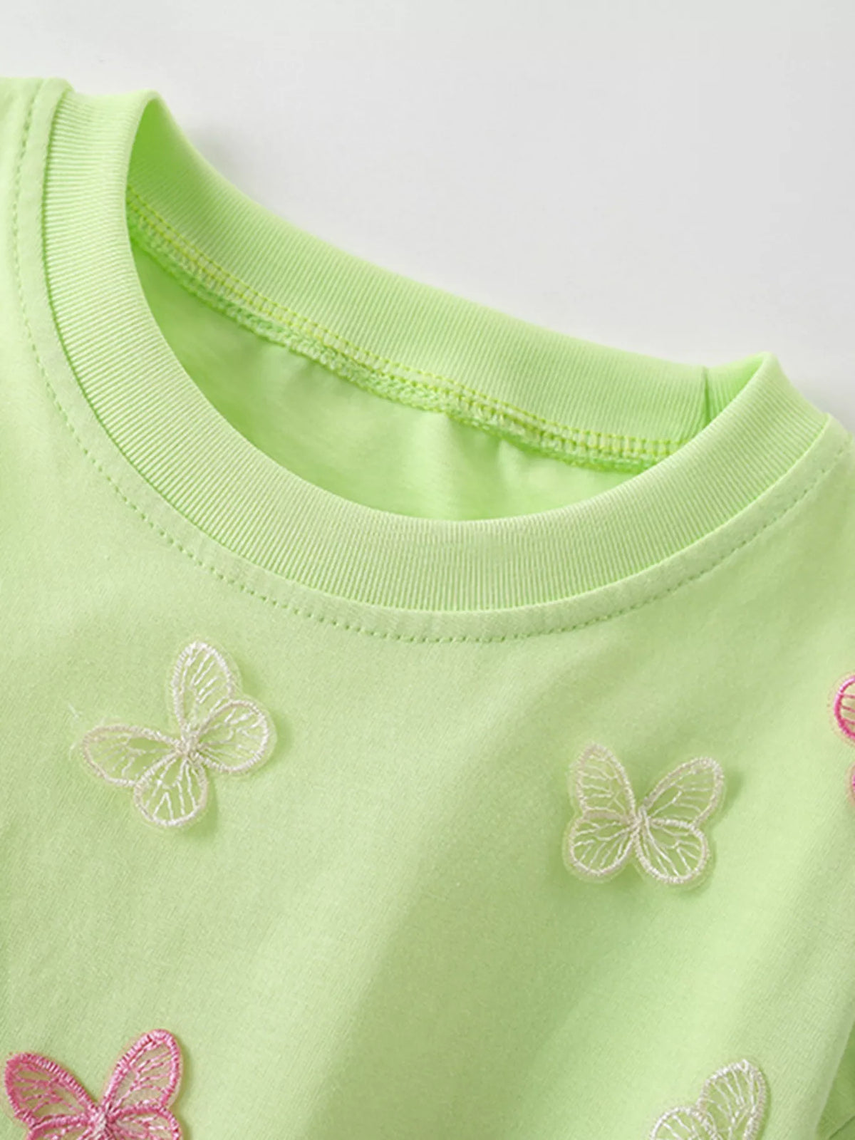 Light green butterfly applique shirt — round neckline