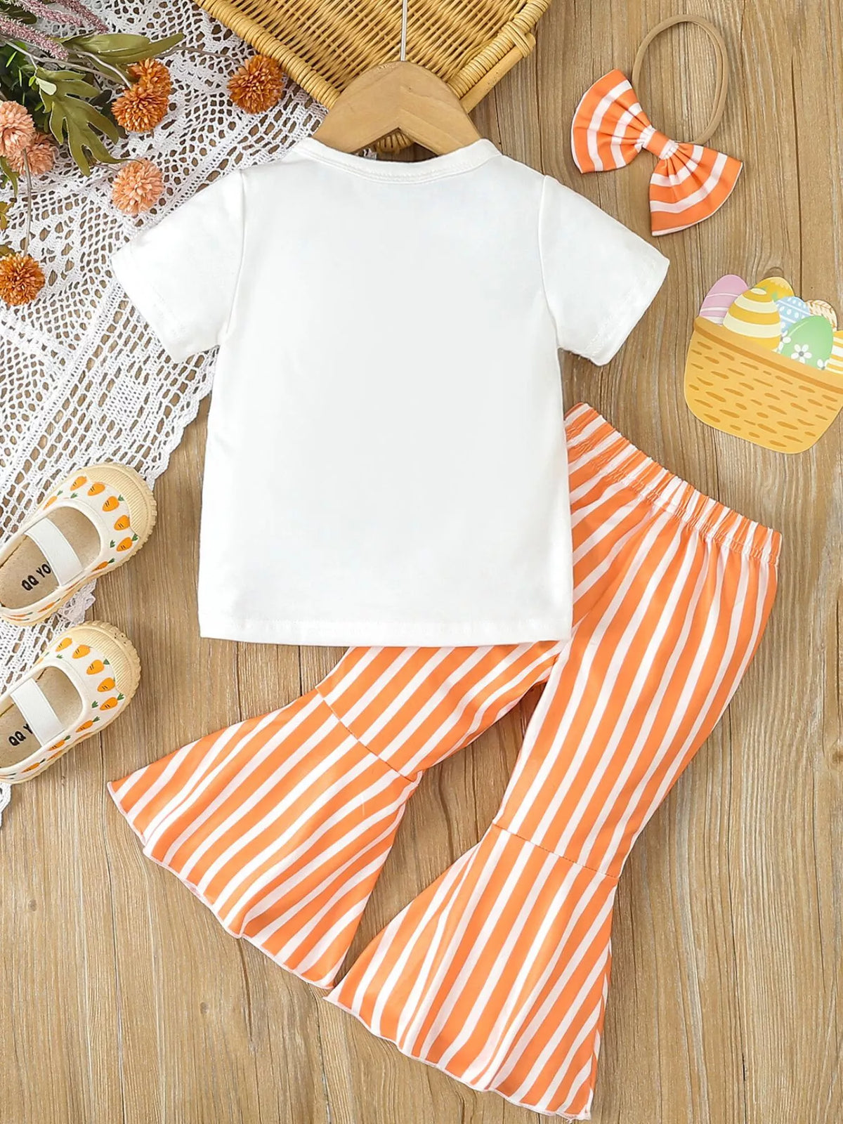 Back of the white tee and orange striped pants