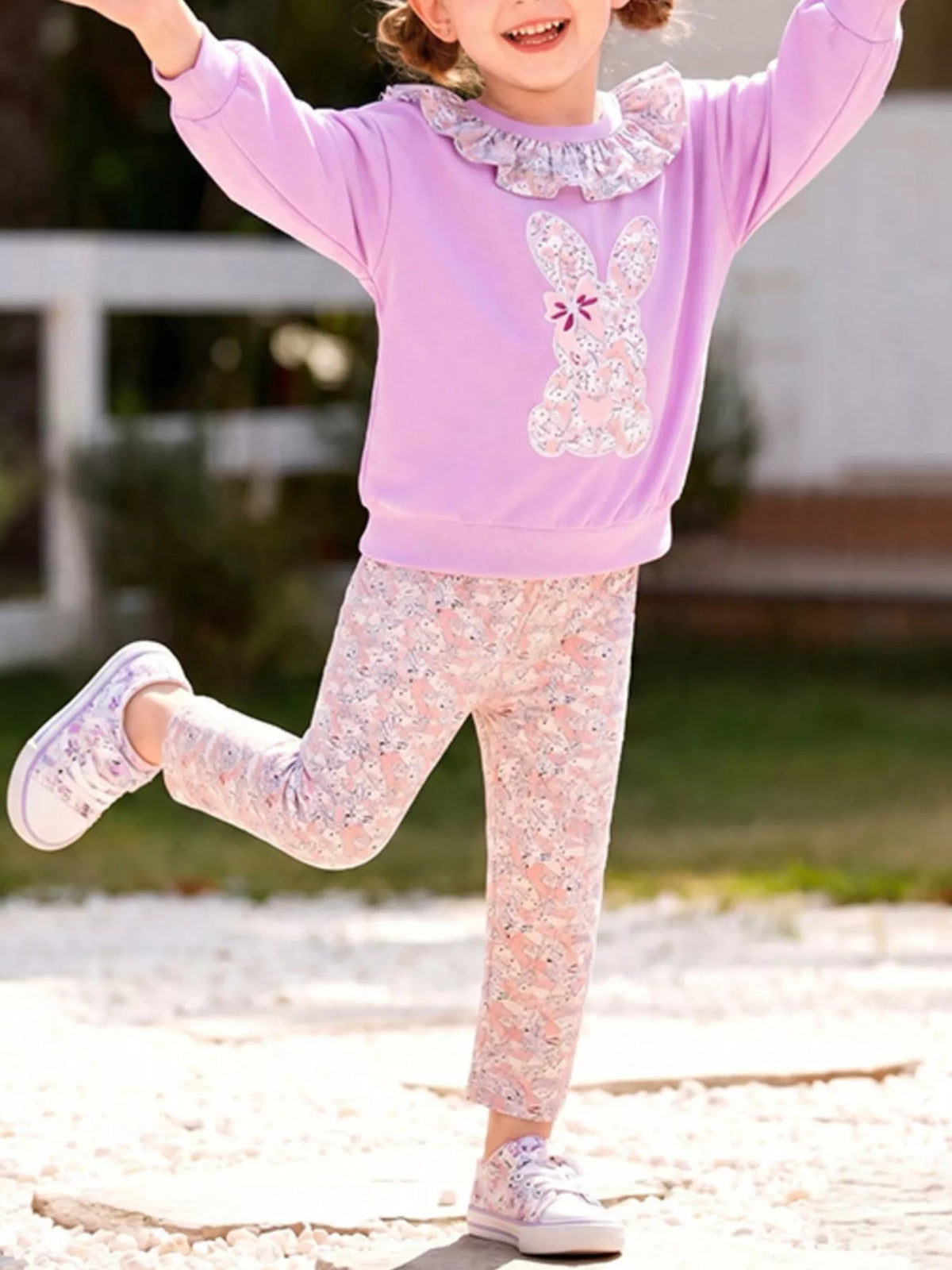 Outfit on a child with arms raised