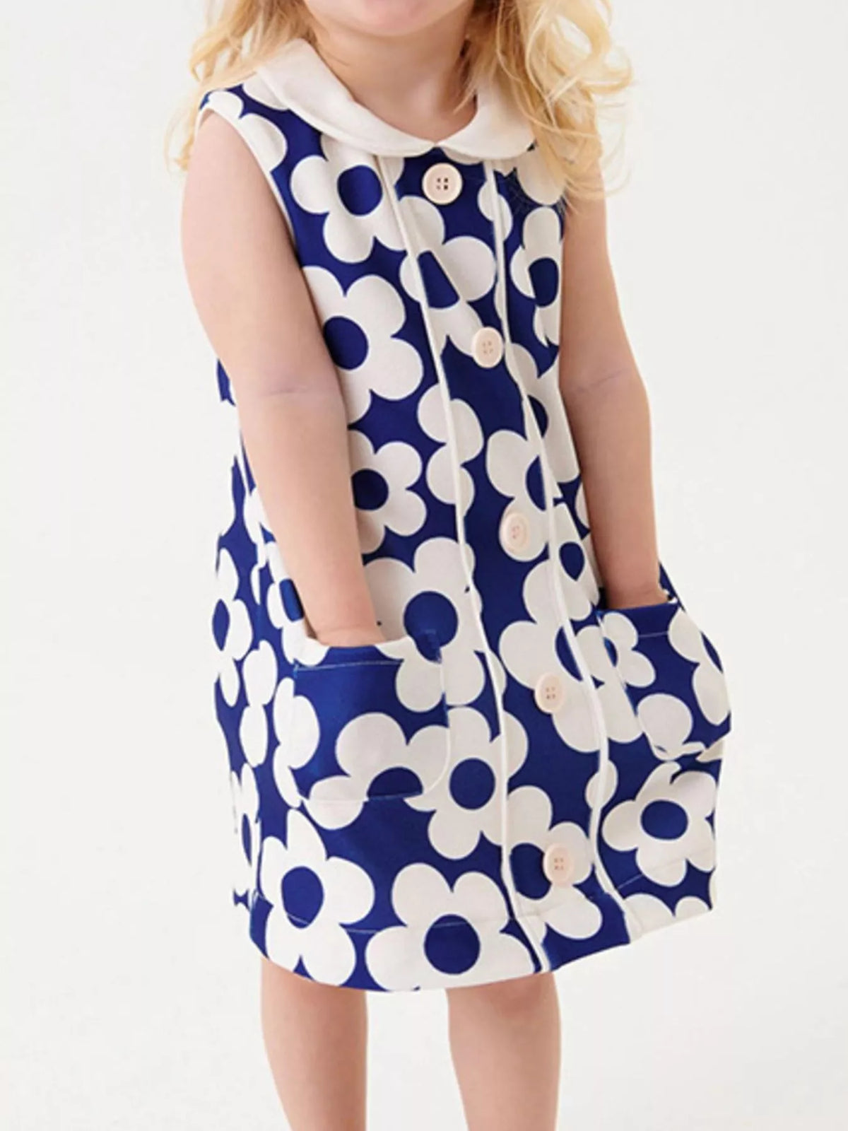 Blue Floral Sleeveless Collared Dress — dress worn by a child standing