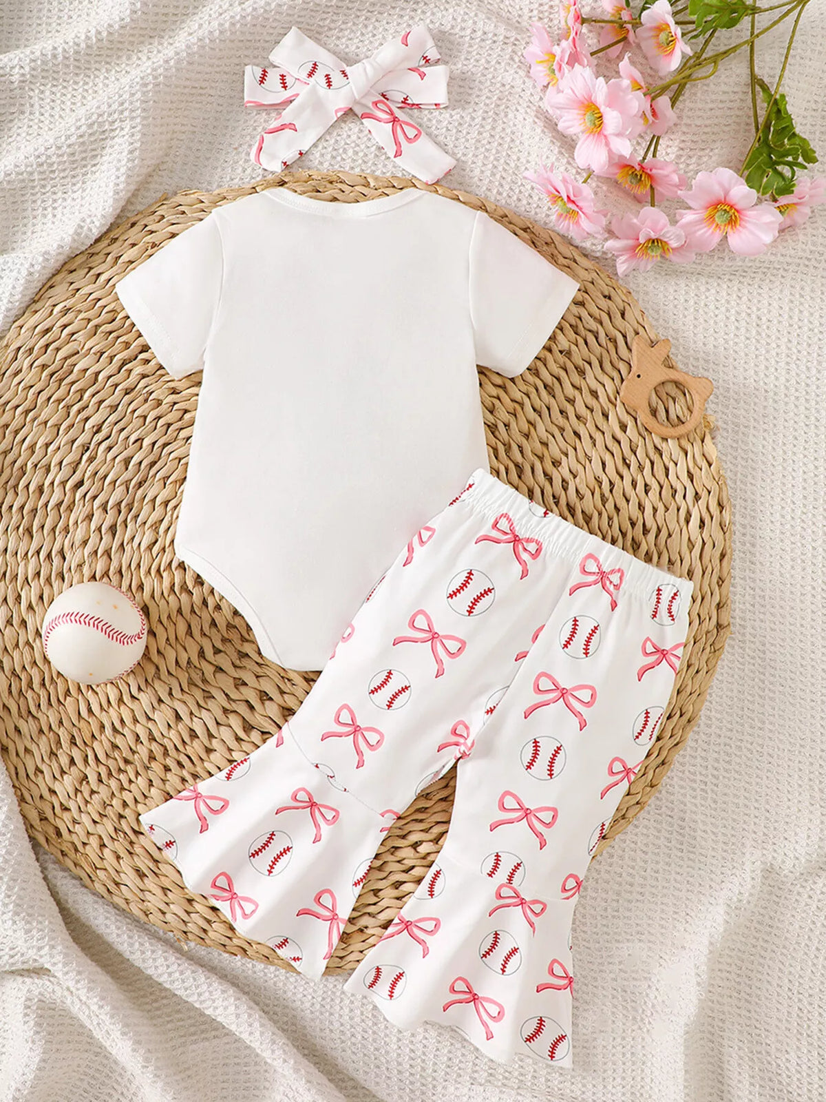 Back of the white bodysuit and printed pants with headband
