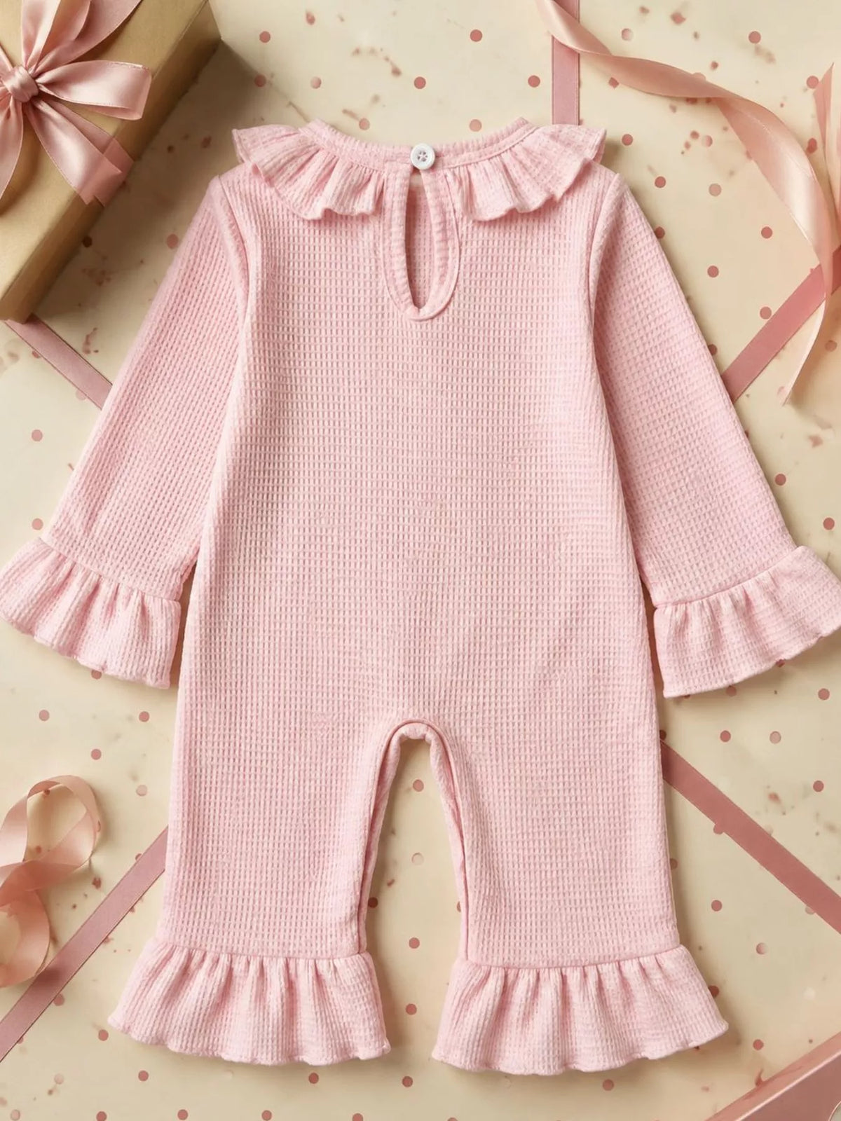 Back of the pink jumpsuit with keyhole neckline