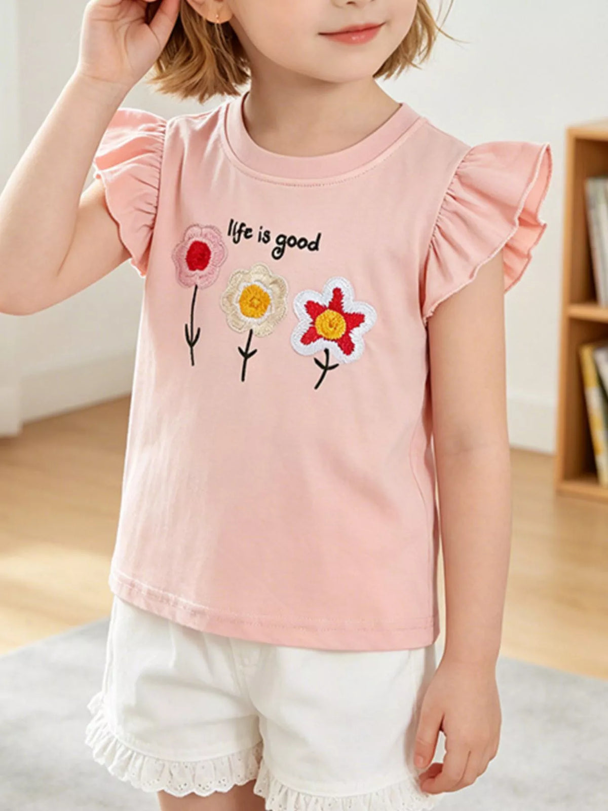 Pink embroidered flower ruffle sleeve shirt — shirt shown on child