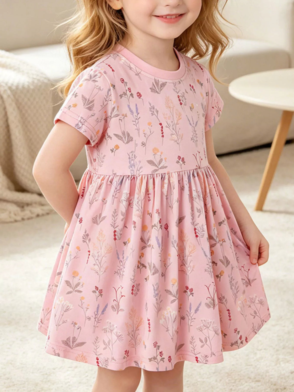 Dusty pink floral short-sleeve dress on a child