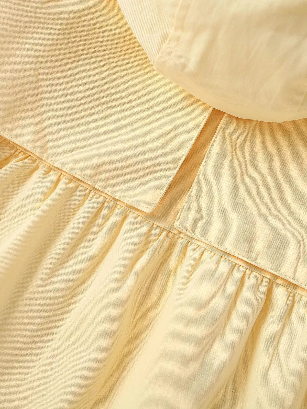 Gathered waist seam and collar detail