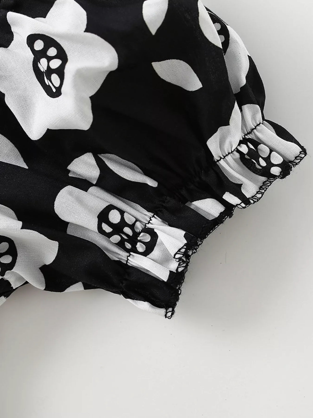 Gathered cuff on a floral puff sleeve