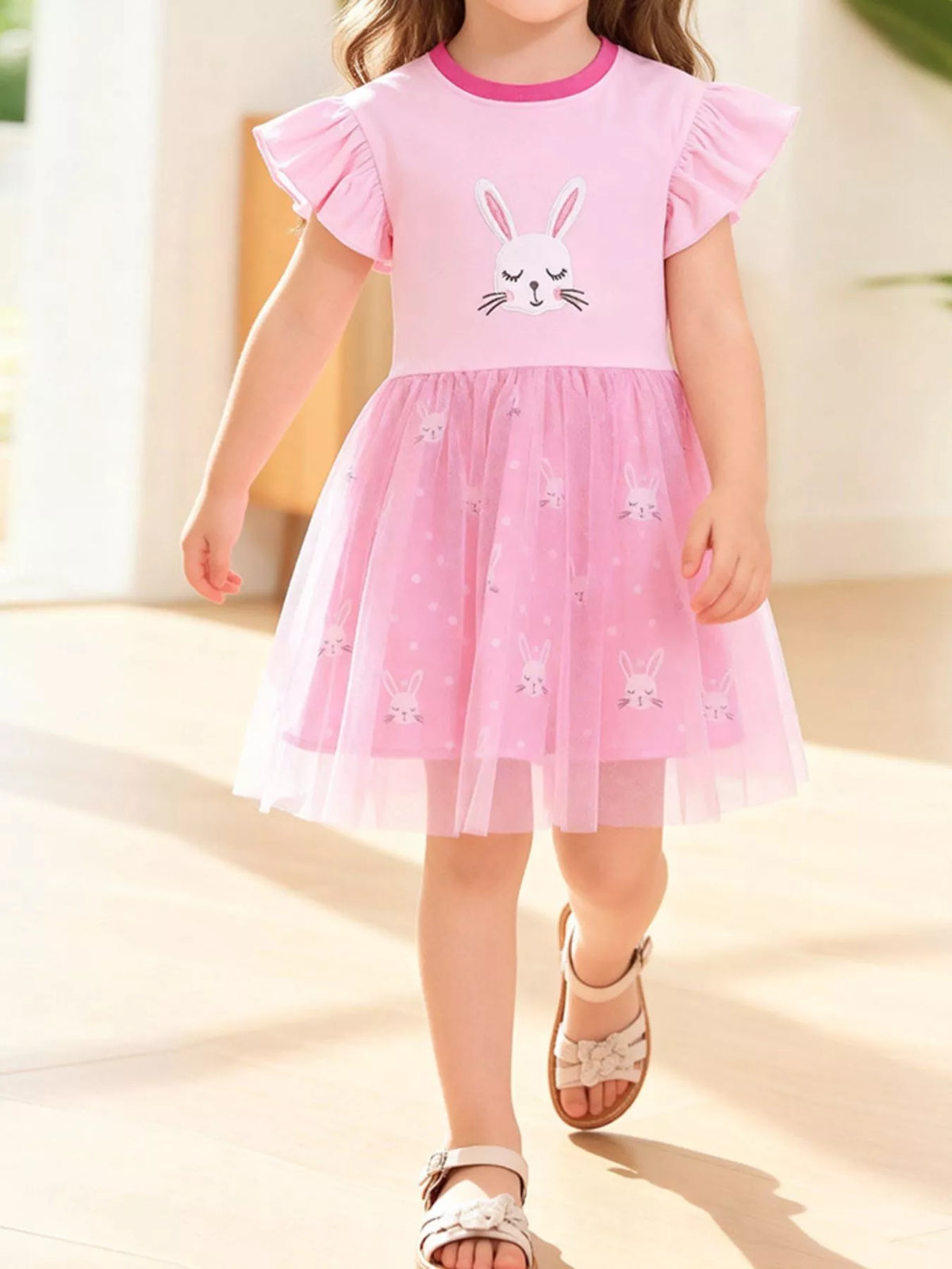 Pink bunny-applique ruffle-sleeve dress with a tulle skirt on a child