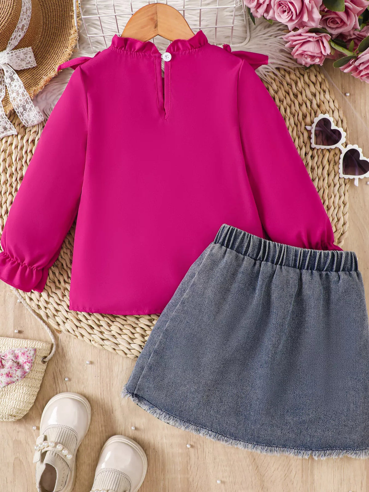 Back of the fuchsia top and gray denim skirt