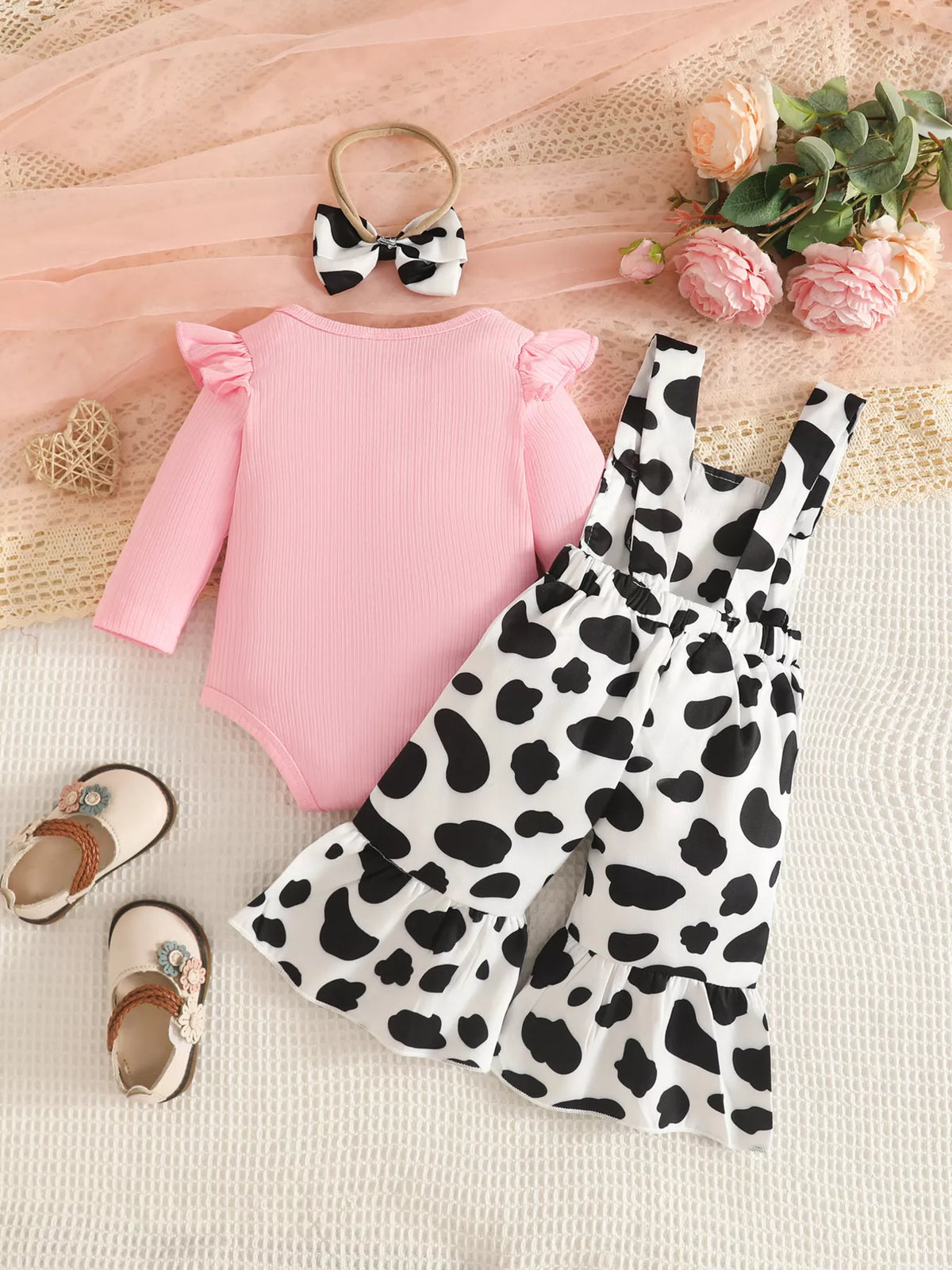Pink bodysuit cow print ruffle overalls and headband — full outfit back