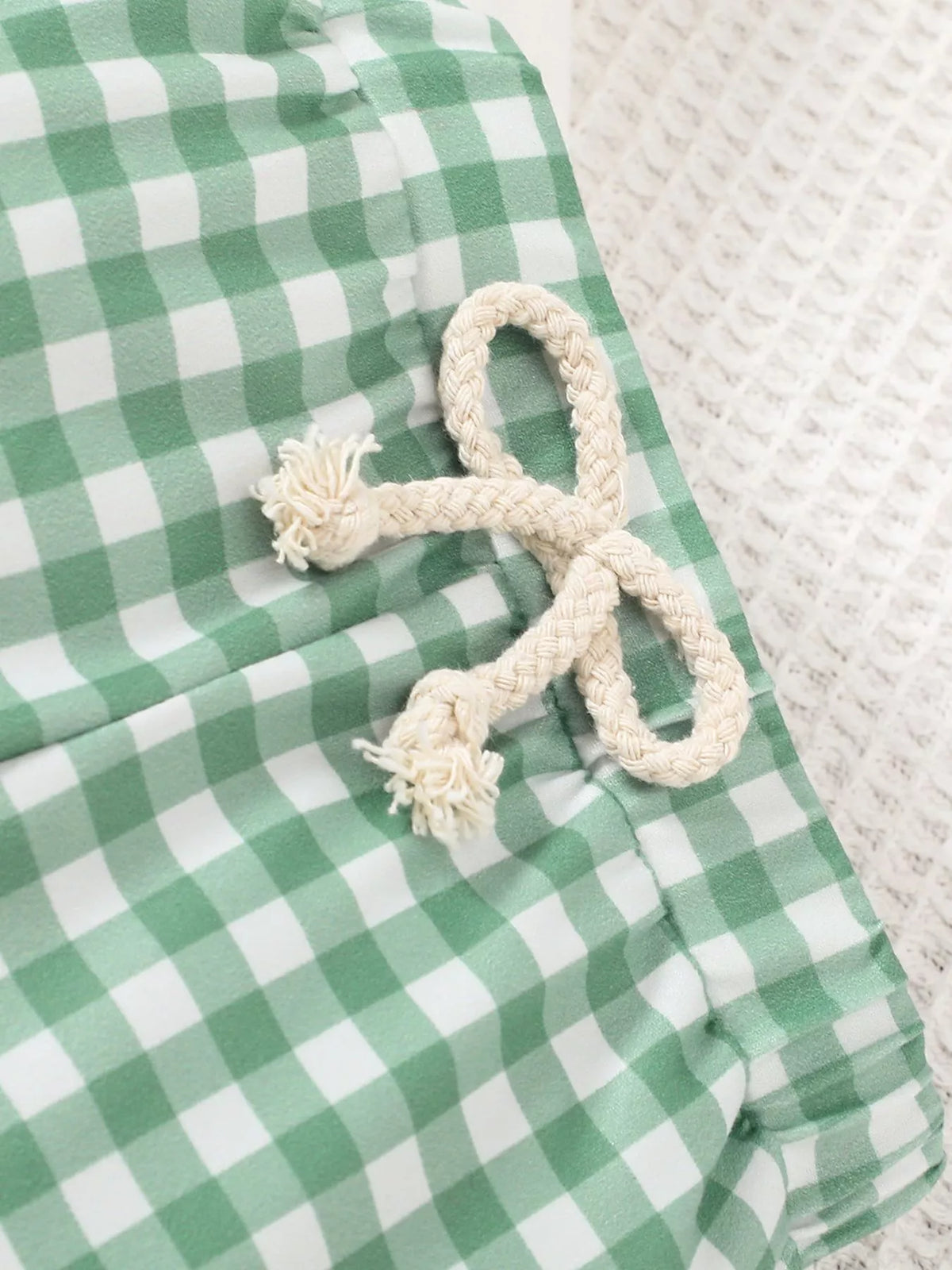 White drawstring on the gingham waistband