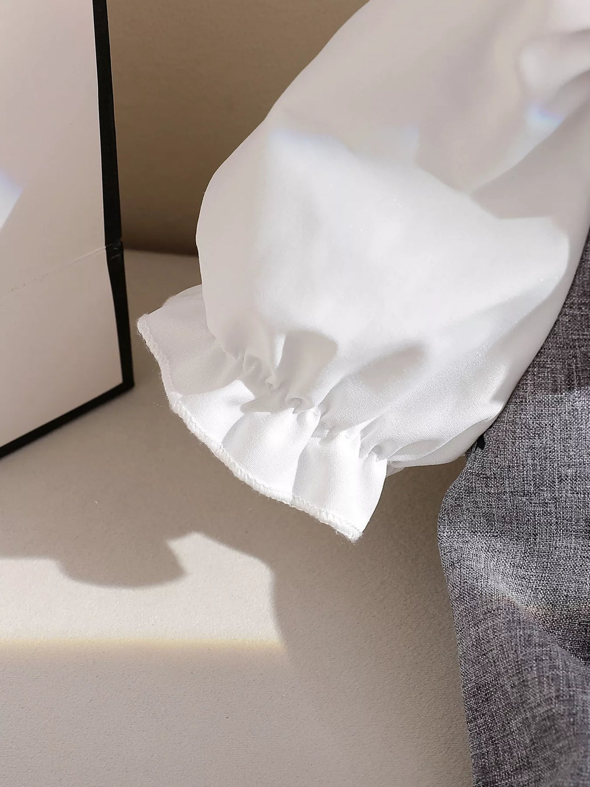 Gathered white puff-sleeve cuff