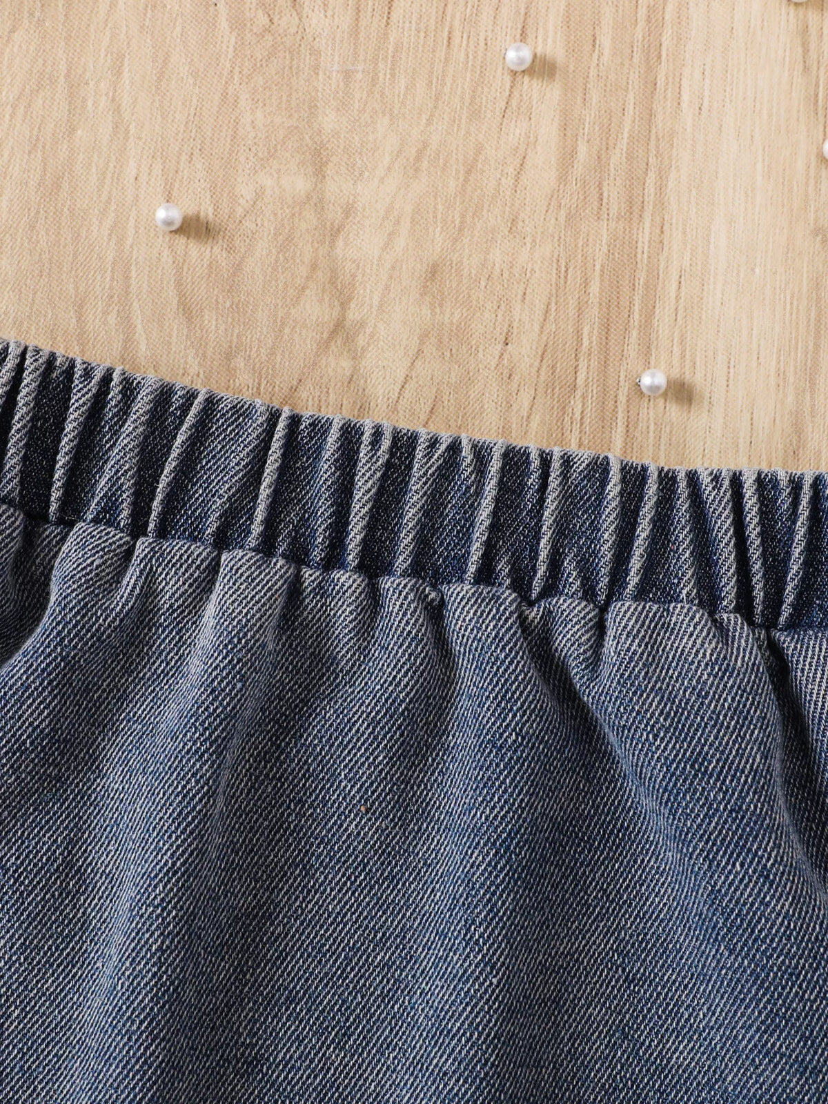 Elastic waistband on the gray denim skirt