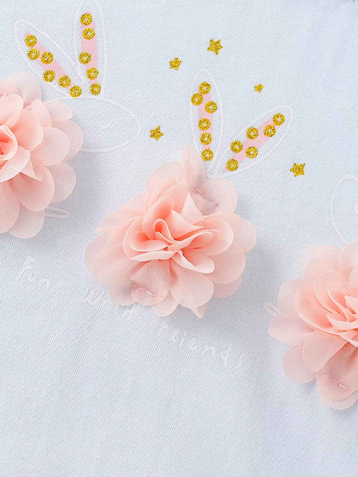 Light blue flower applique puff sleeve ruffle hem top — pink flowers with gold details