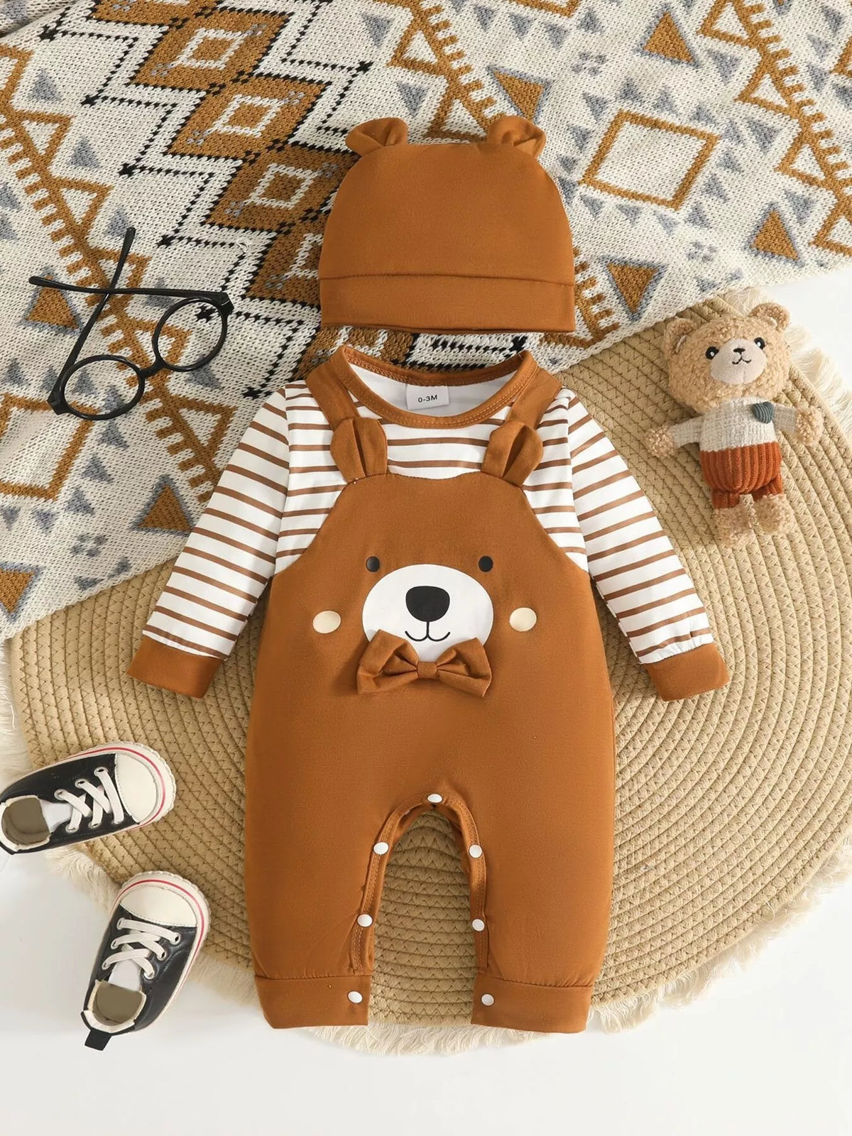 Brown bear jumpsuit with striped sleeves and hat — full outfit front