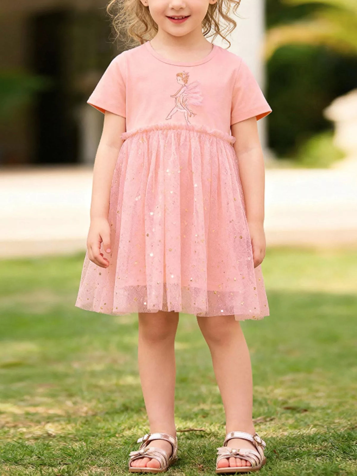 Peach fairy dress with a gold-speckled tulle skirt on a child