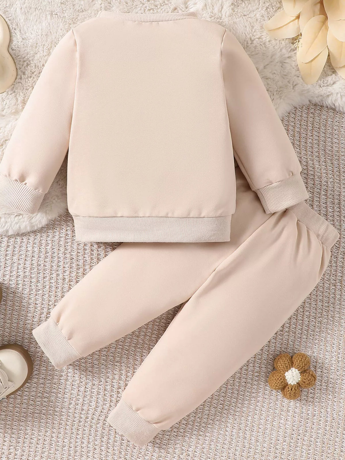 Back of the cream sweatshirt and pants