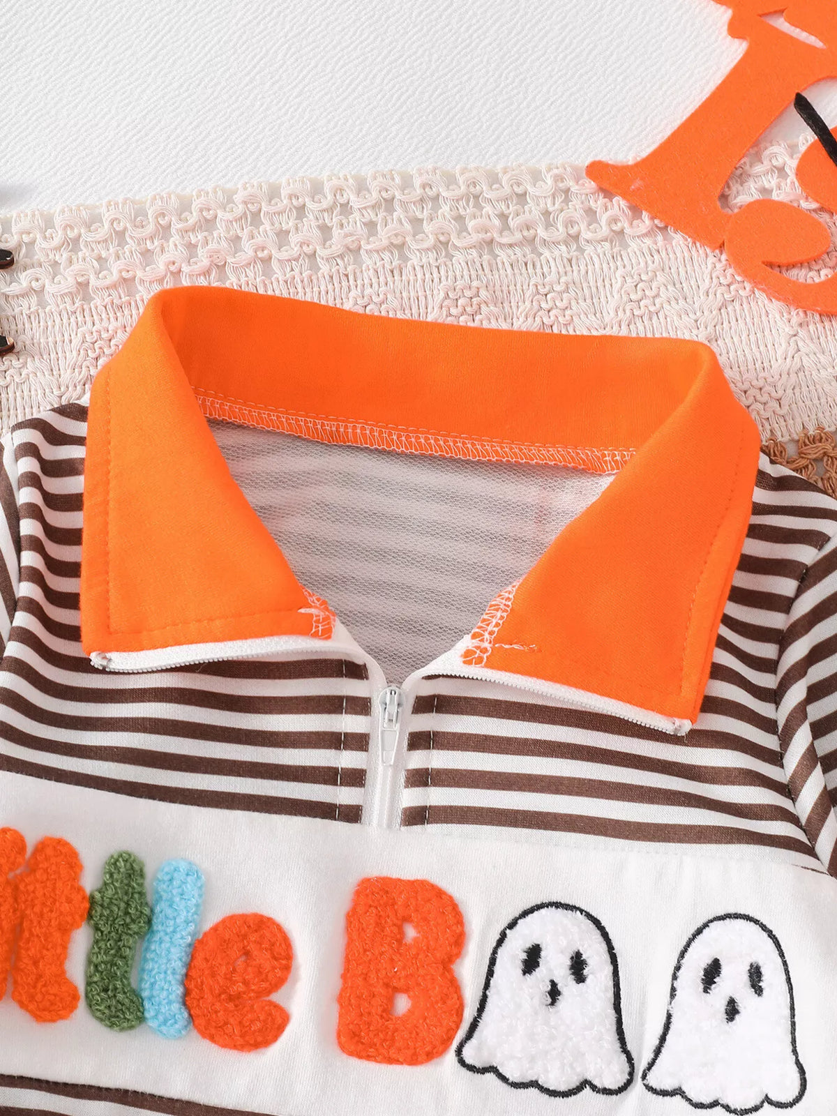 Orange collar above brown stripes
