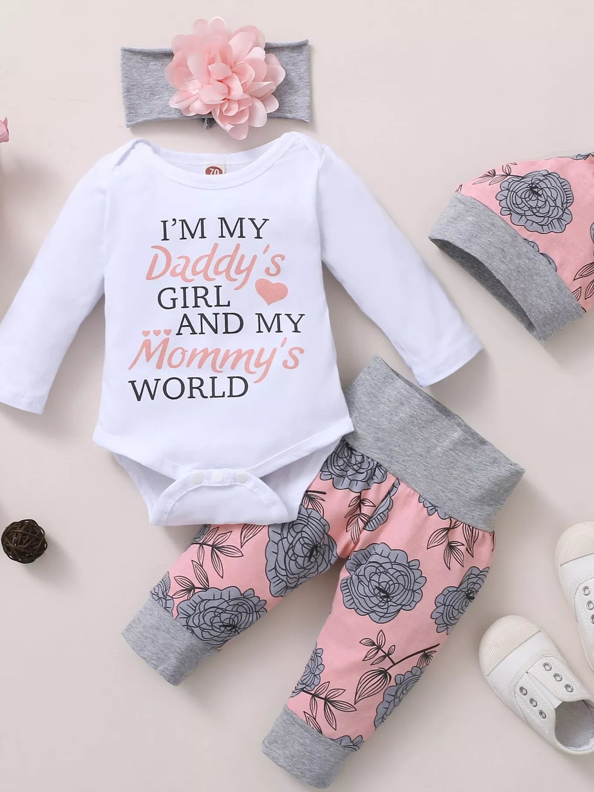 Baby Letter Bodysuit and Floral Pants Four-Piece Set — bodysuit pants headband and hat flat lay