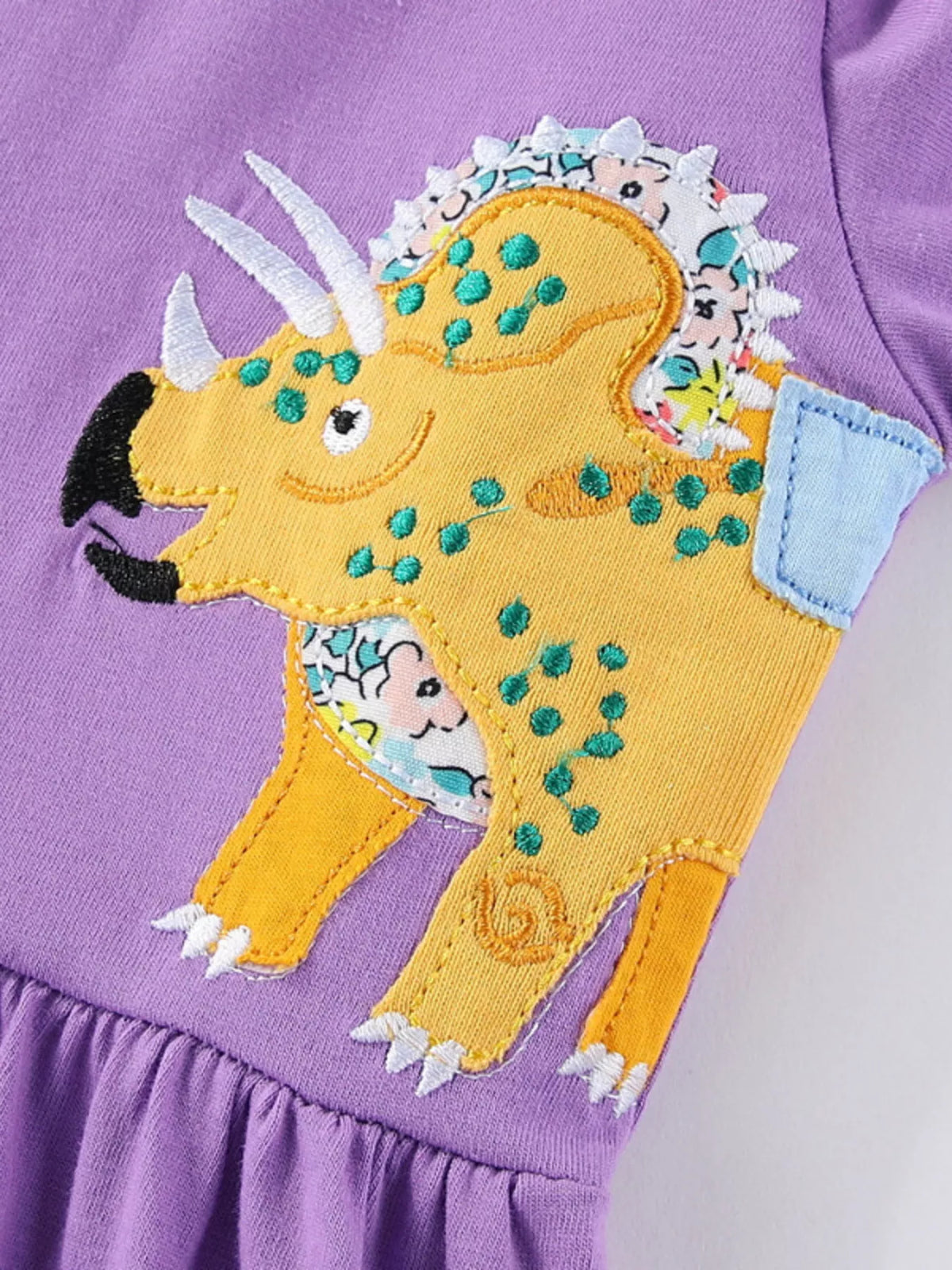 Lavender Dinosaur Long Sleeve Dress — dinosaur applique close-up