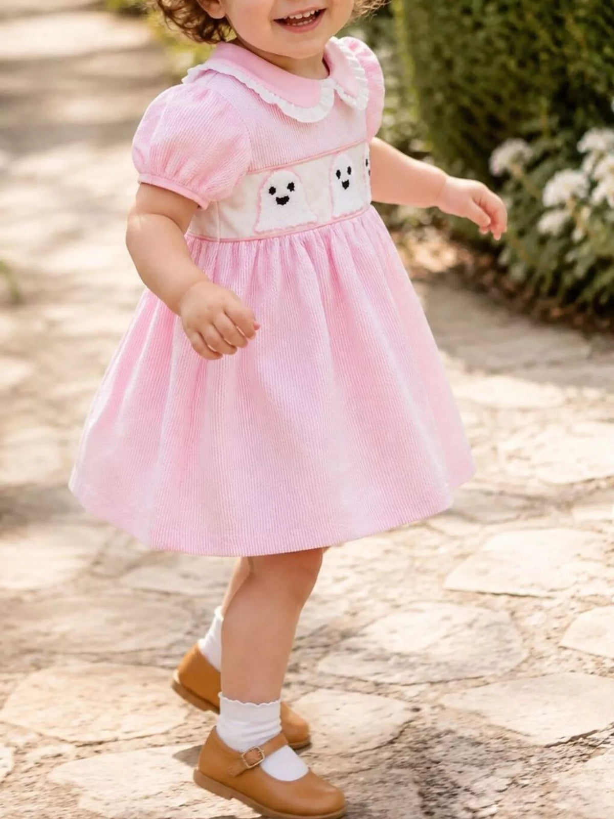 Side view of the pink gingham dress on a child