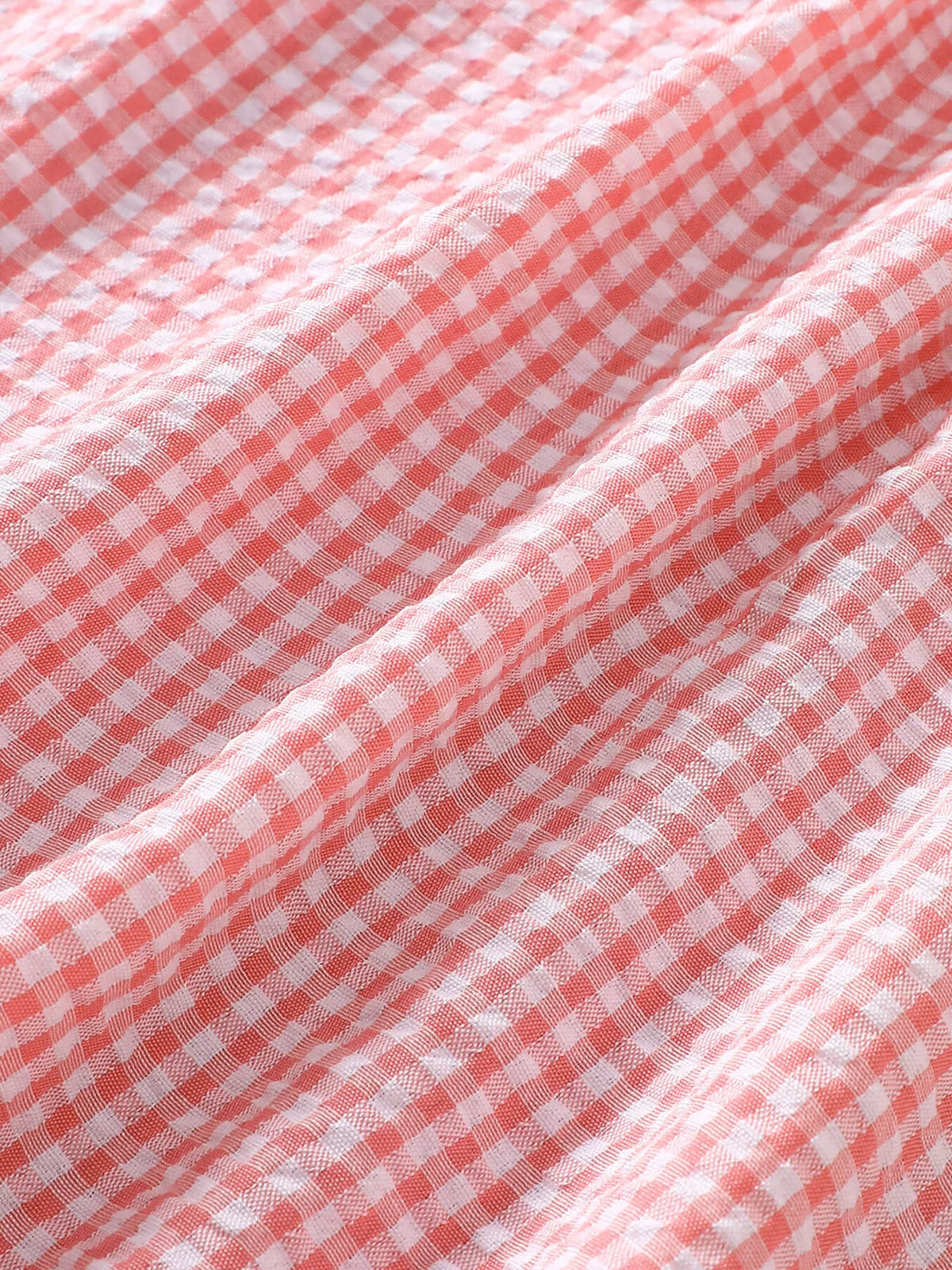 Pink gingham fabric close-up