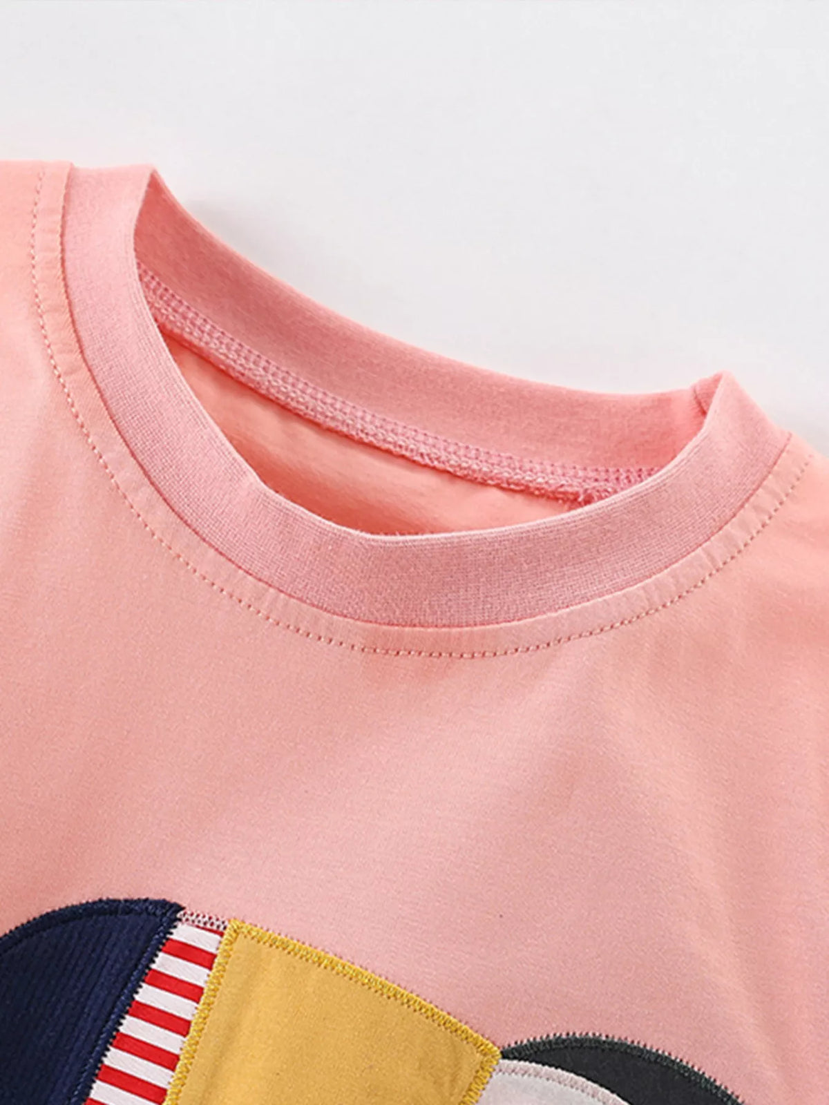 Coral toucan applique shirt — round neckline