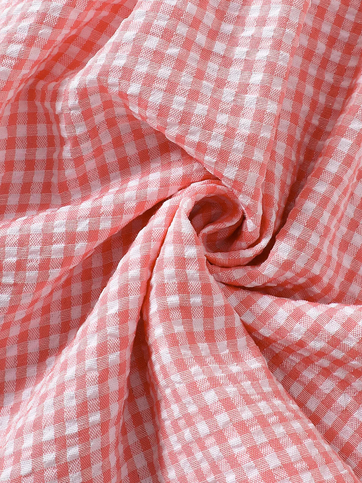 Gathered pink gingham fabric detail