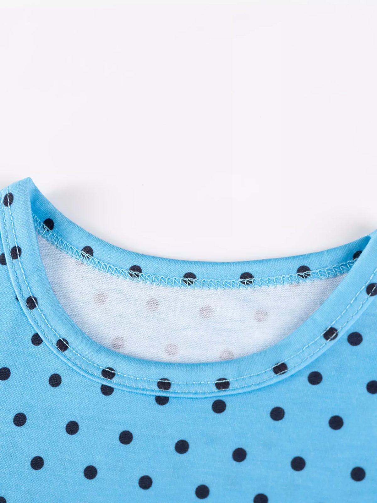 Blue round neckline with dark polka dots