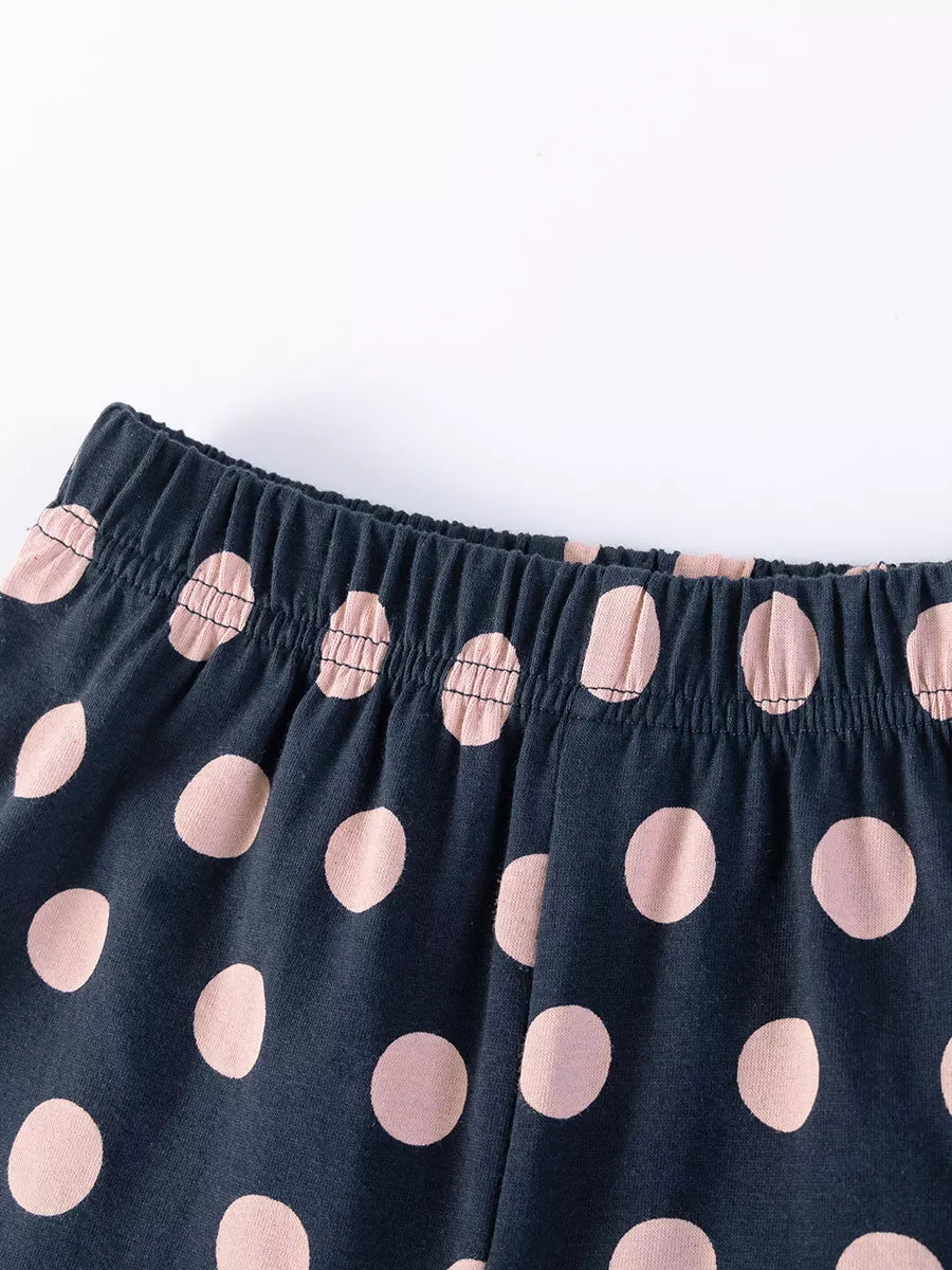Elastic waistband on navy shorts with pink dots