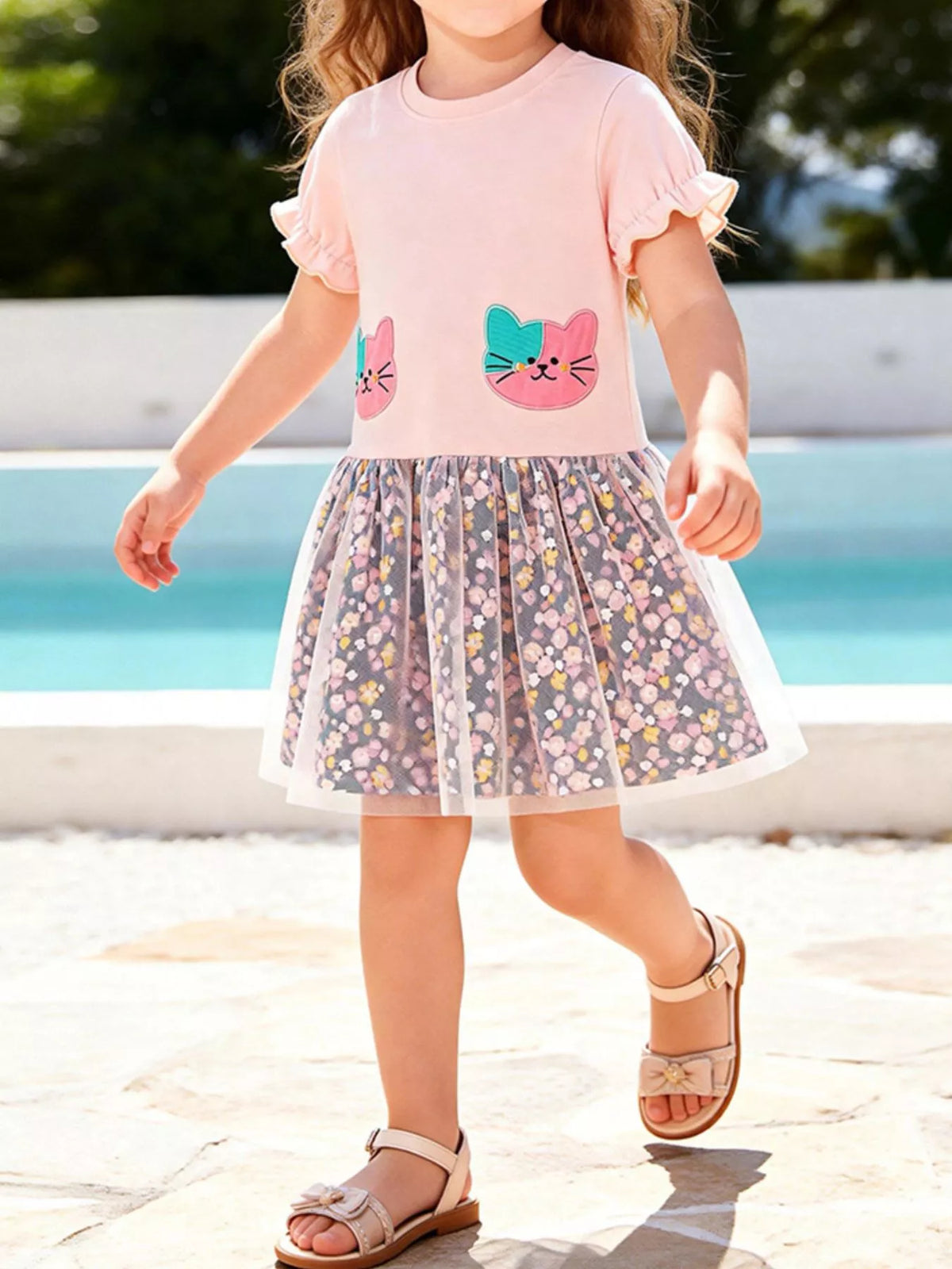 Pink cat-applique dress with a floral tulle skirt on a child