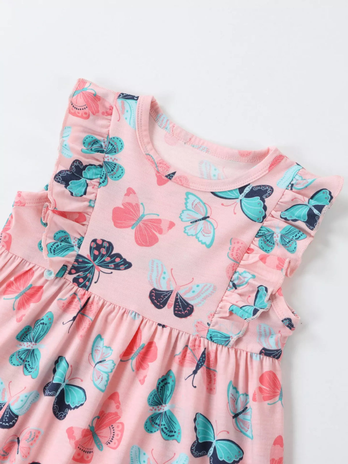 Round neckline and butterfly-print shoulder ruffles