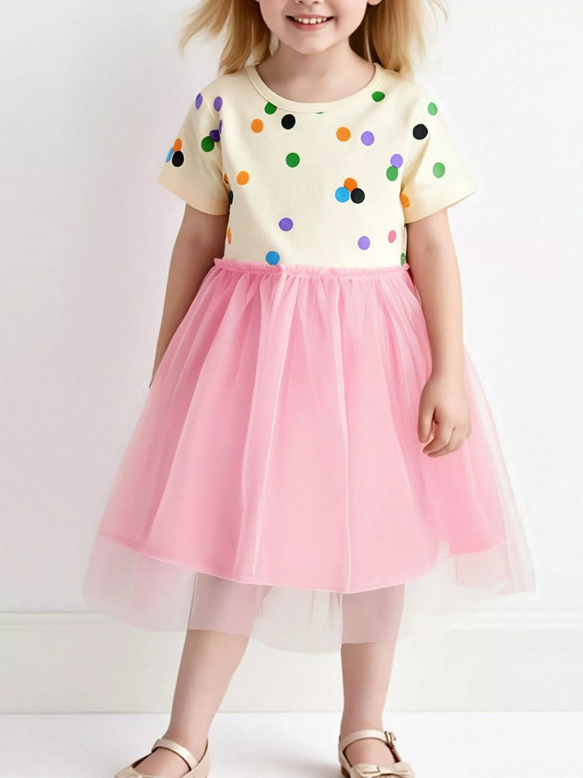 Polka Dot Pink Tulle Dress — dress worn by a child
