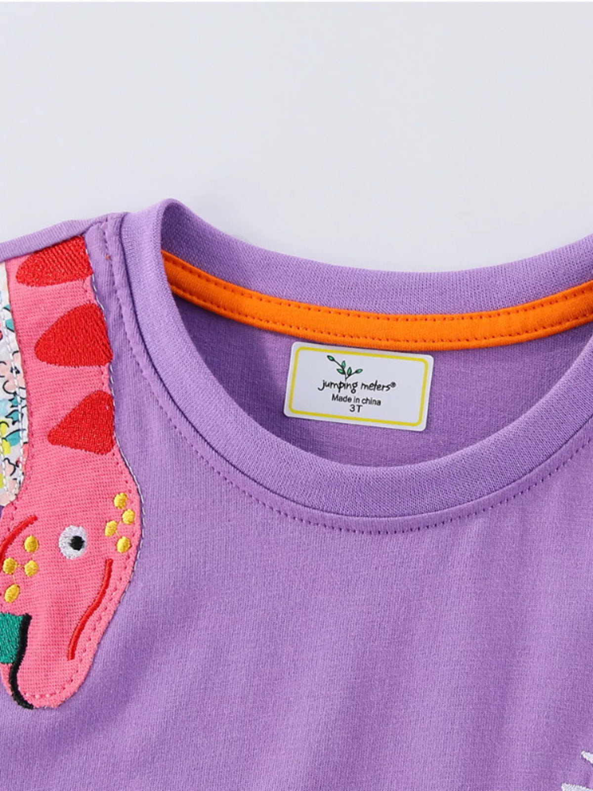Lavender Dinosaur Long Sleeve Dress — neckline and dinosaur detail