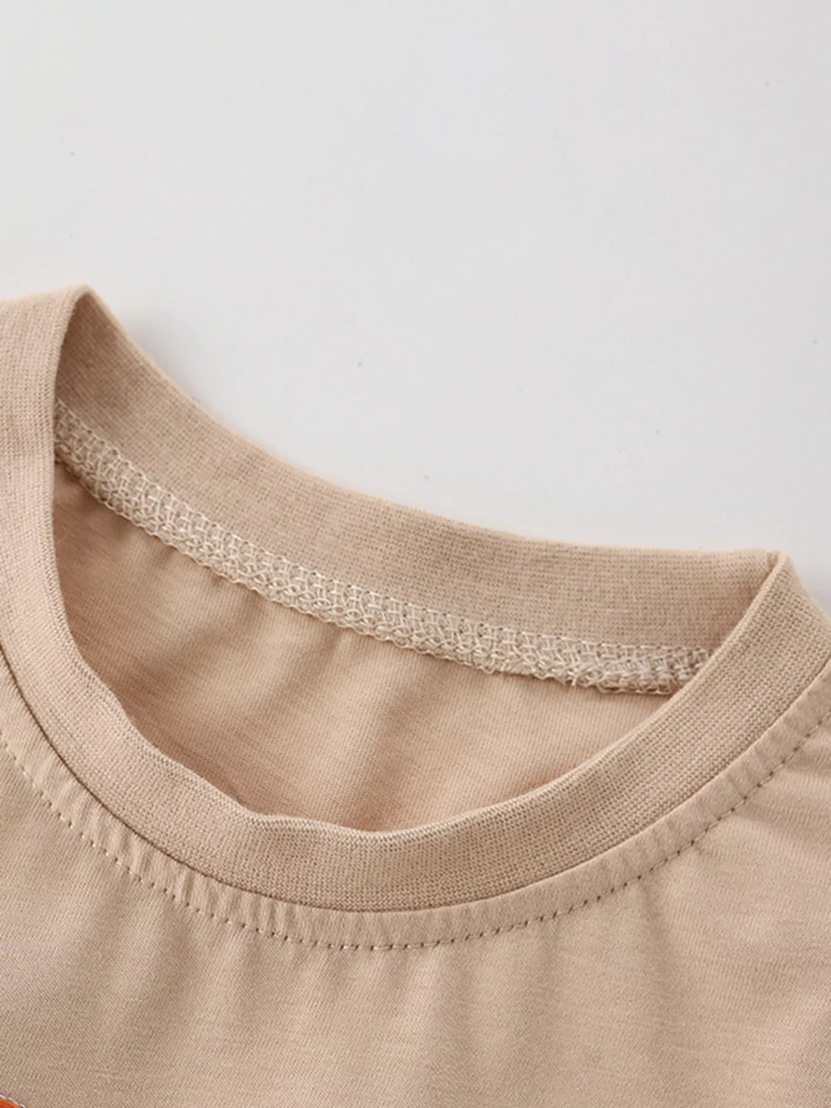 Beige rocket applique shirt — round neckline