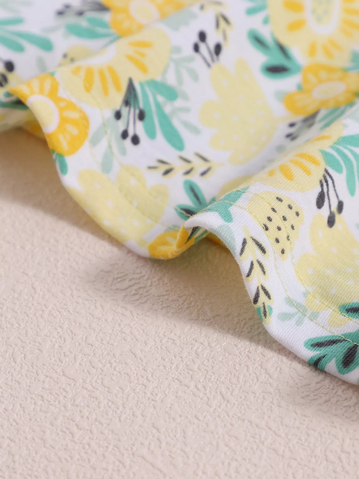 Stitched yellow floral skirt hem