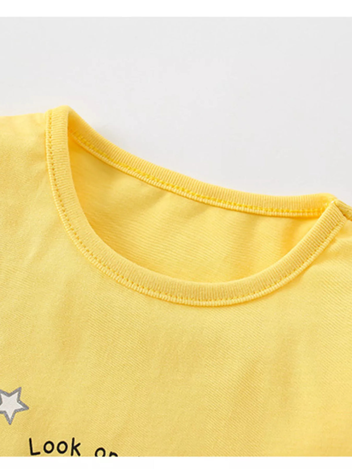Yellow winged unicorn rainbow ruffle hem top — round neckline
