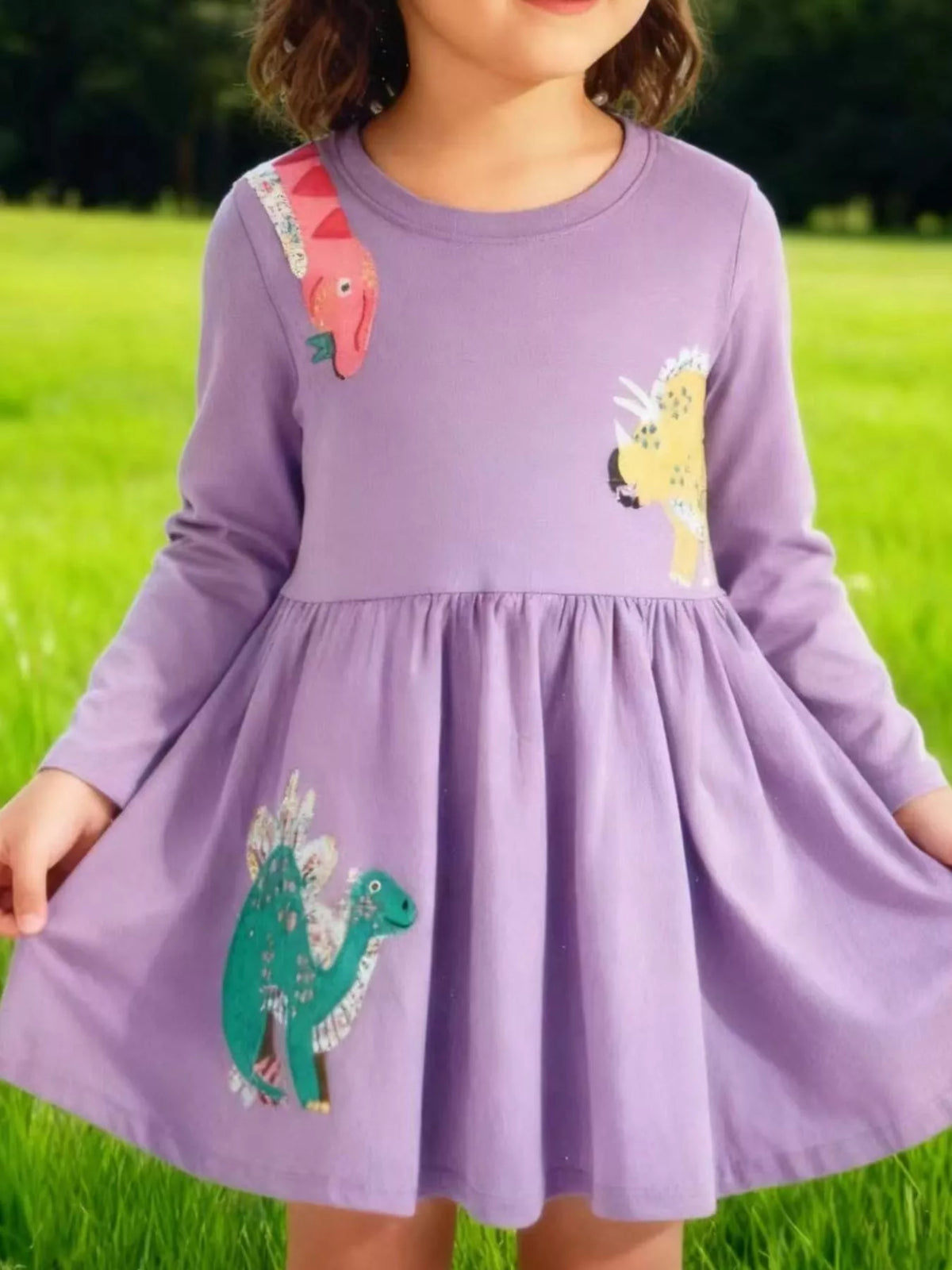 Lavender Dinosaur Long Sleeve Dress — dress worn by a child