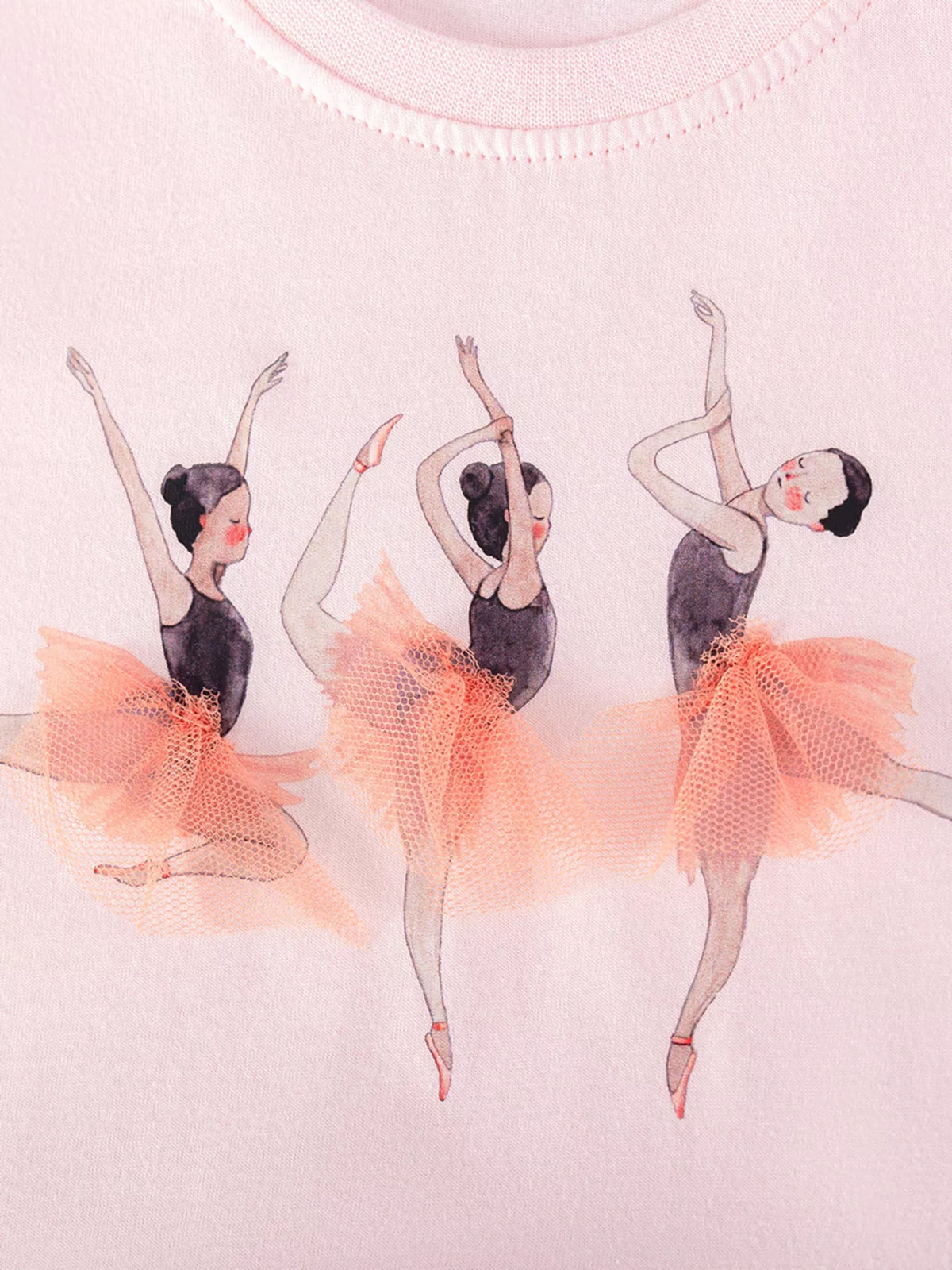 Three ballerinas with raised peach tulle skirts