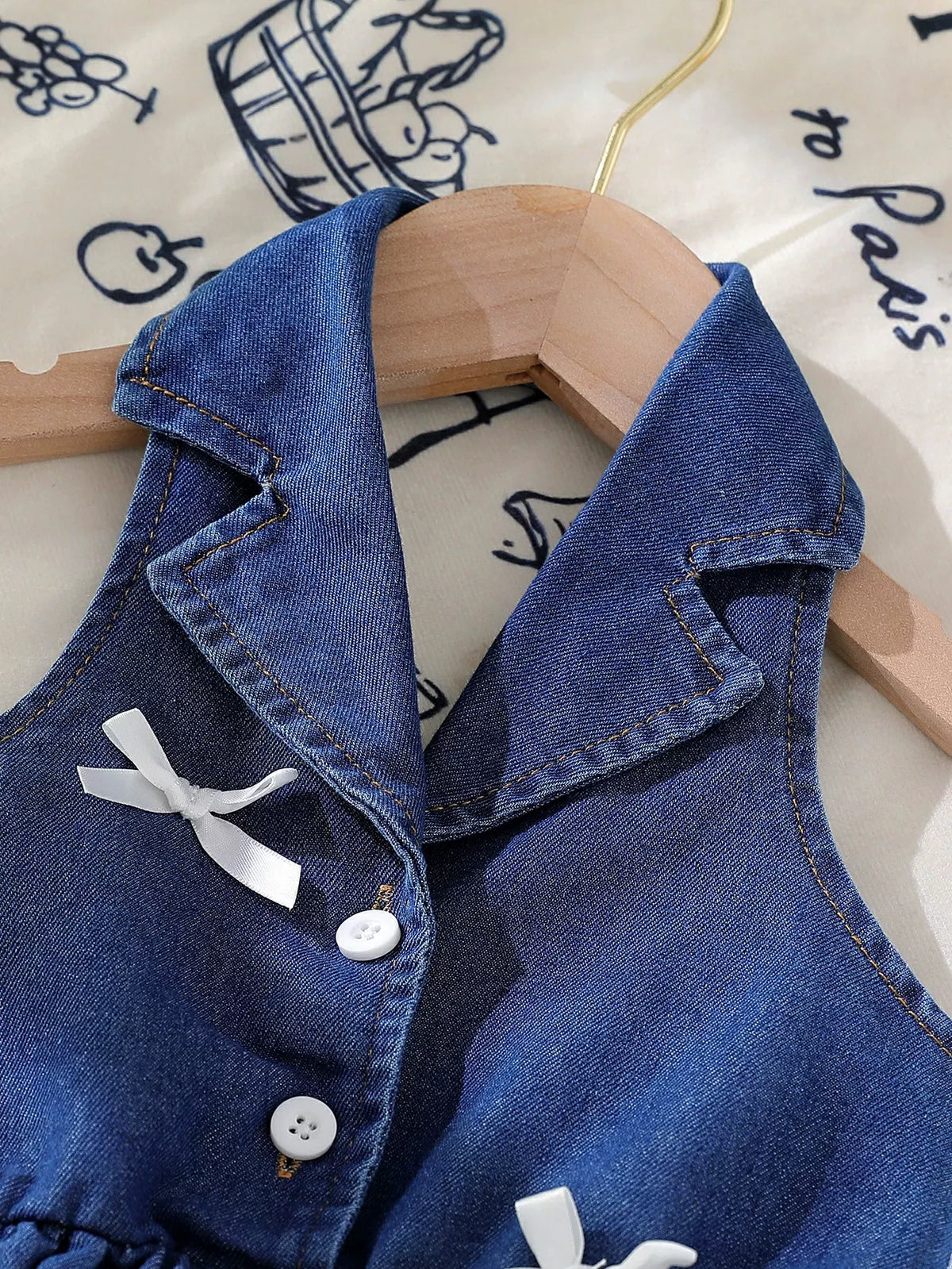 Sleeveless Denim Bow Dress — lapel collar and bow detail