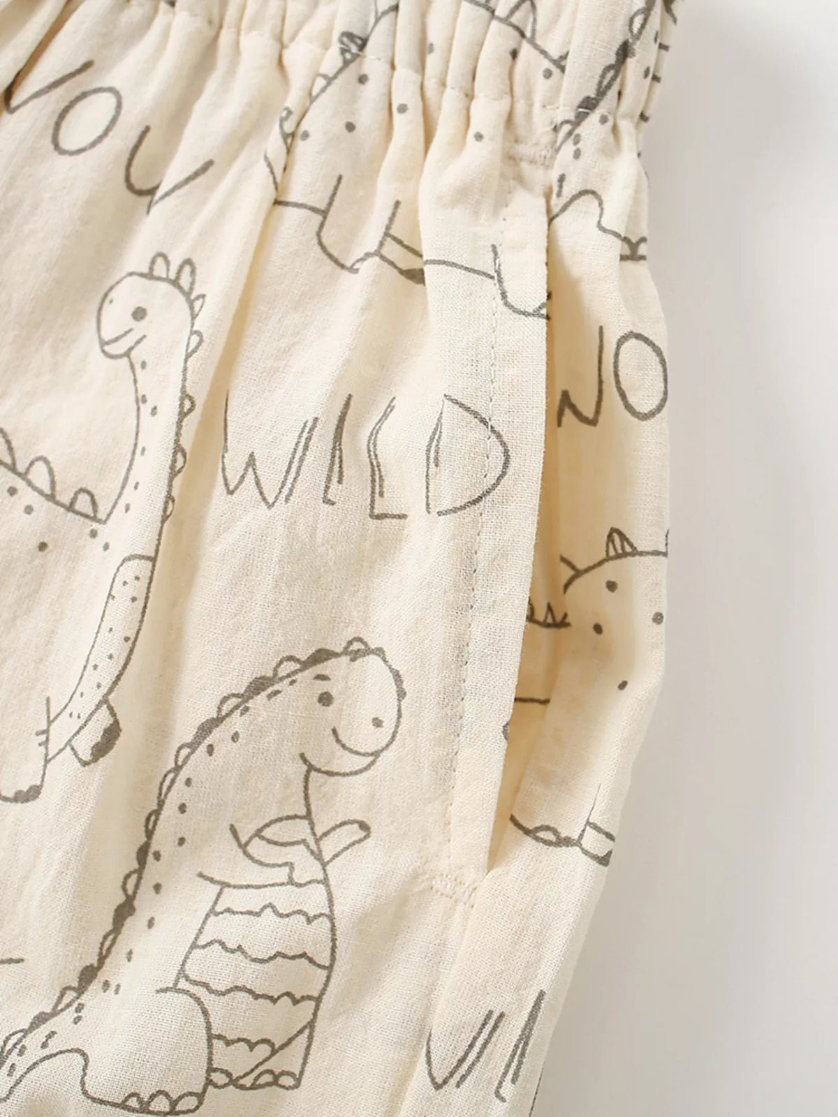 Side pocket beside the dinosaur print