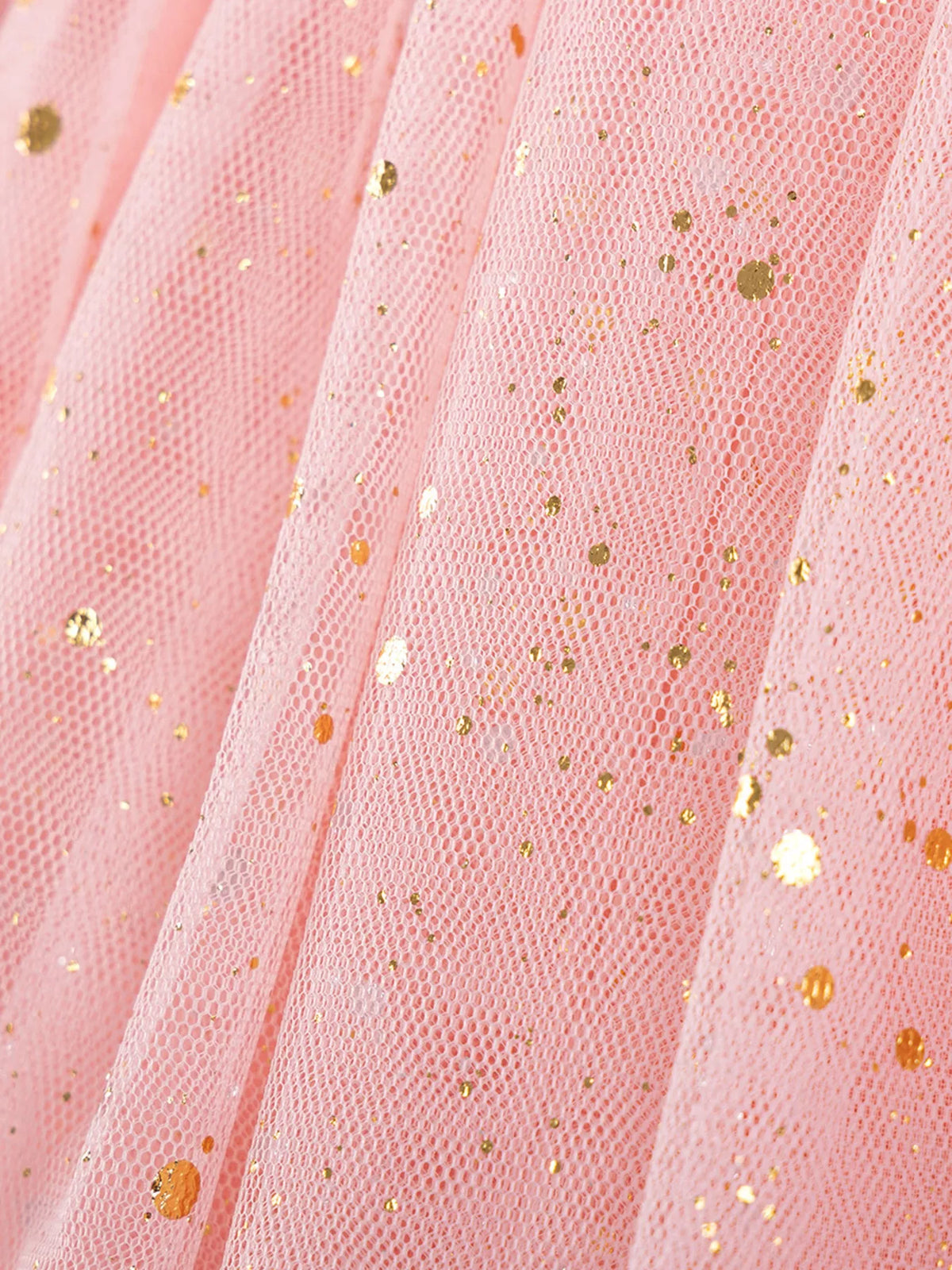 Gold speckles on peach tulle