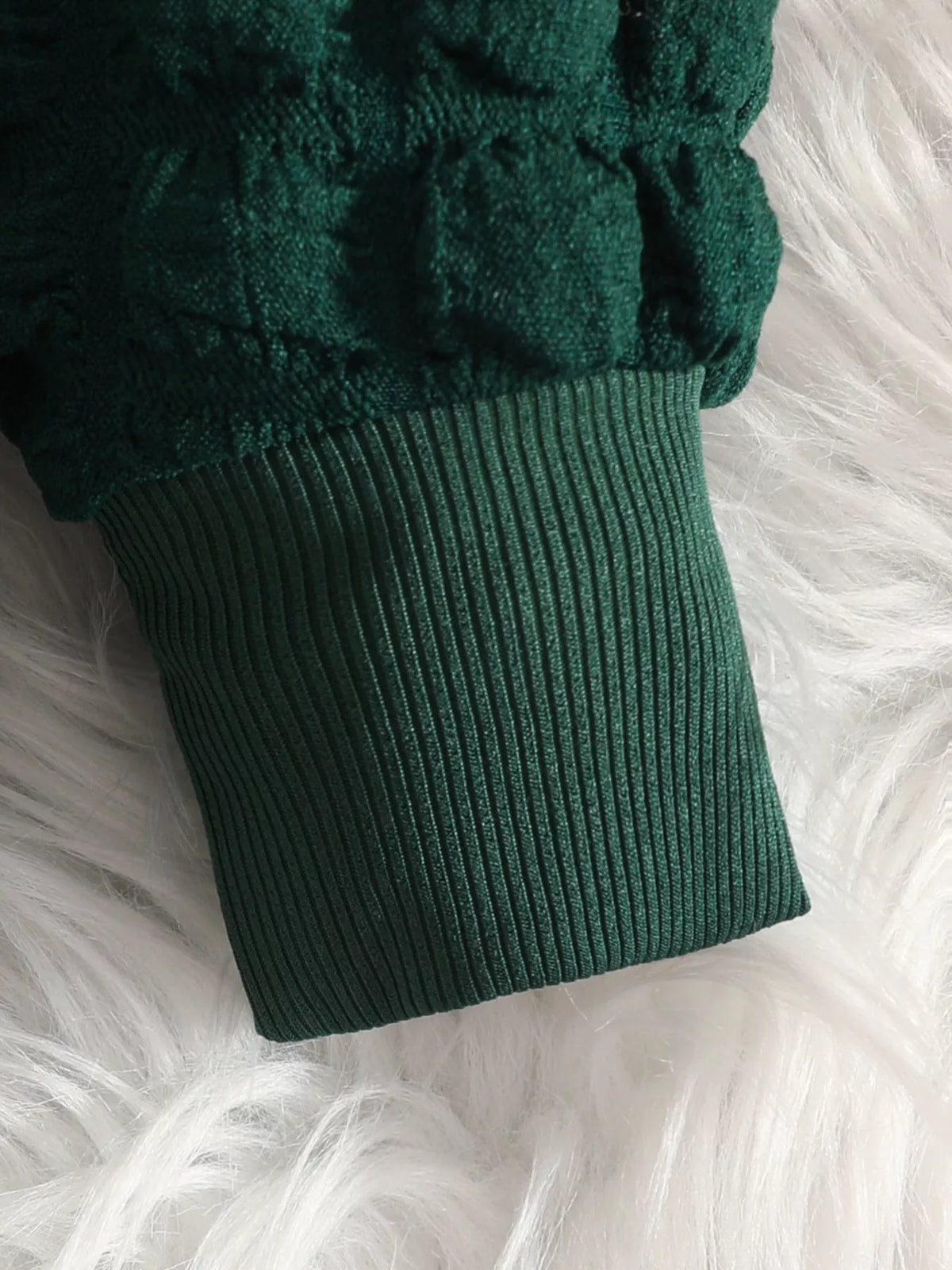Green textured sleeve and ribbed cuff