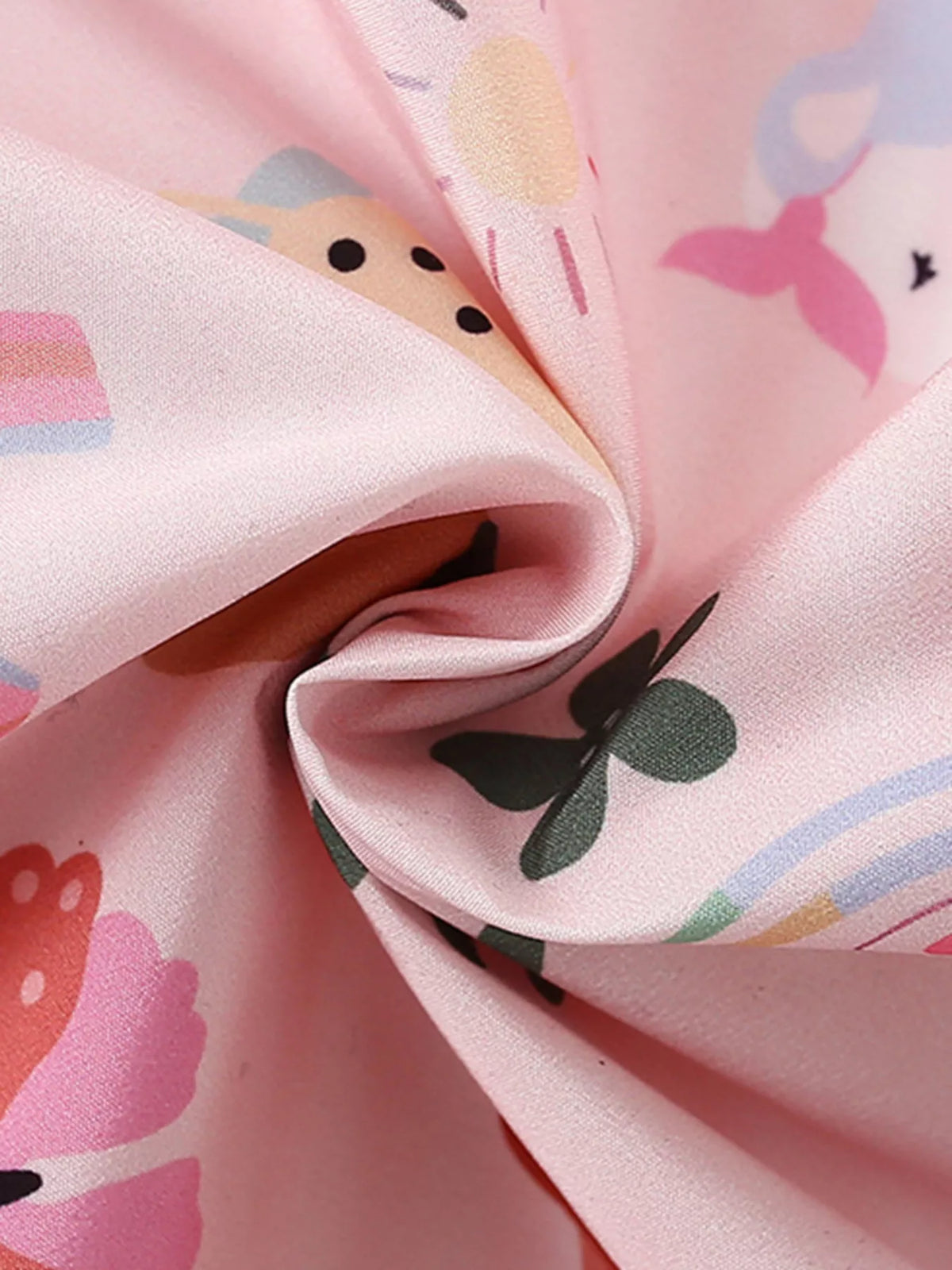 Pink unicorn-and-flower fabric close-up